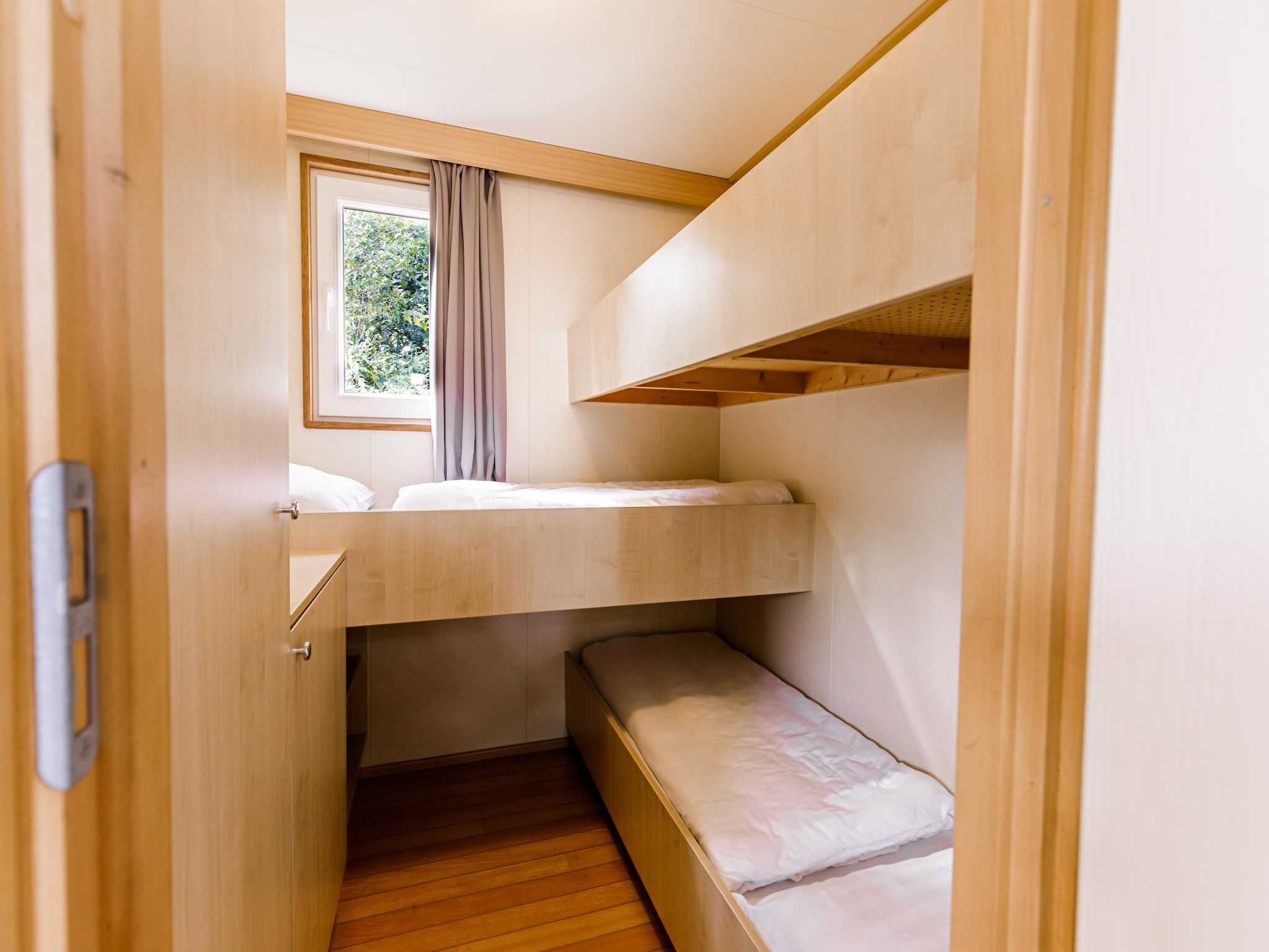 Een slaapkamer van Vakantiepark Leukermeer 5 in Well