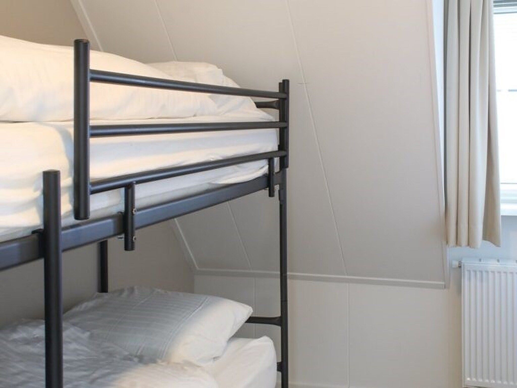 Een slaapkamer van Recreatiepark Idskenhuizen 4 in Idskenhuizen