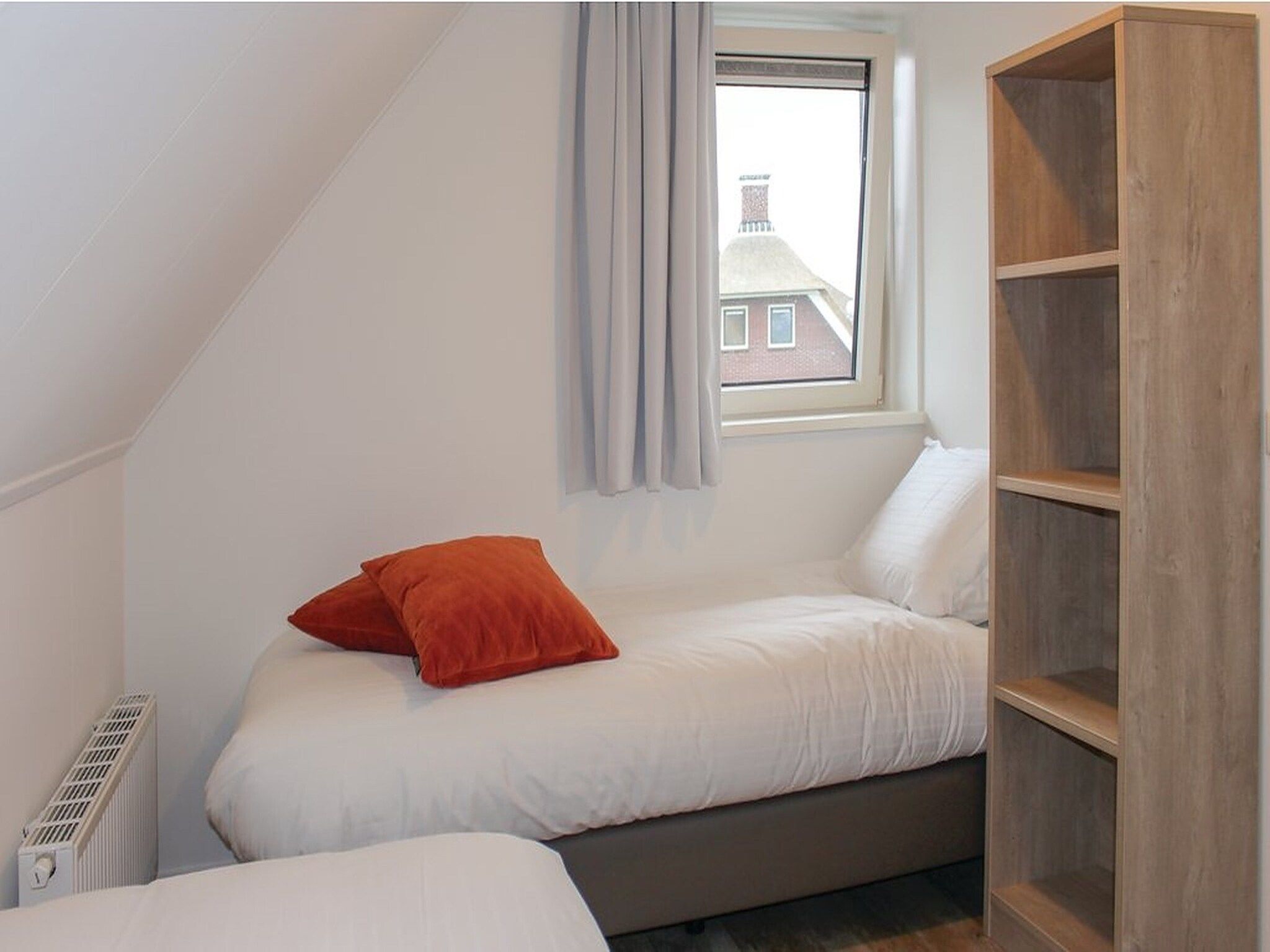 Een slaapkamer van Recreatiepark Idskenhuizen 10 in Idskenhuizen