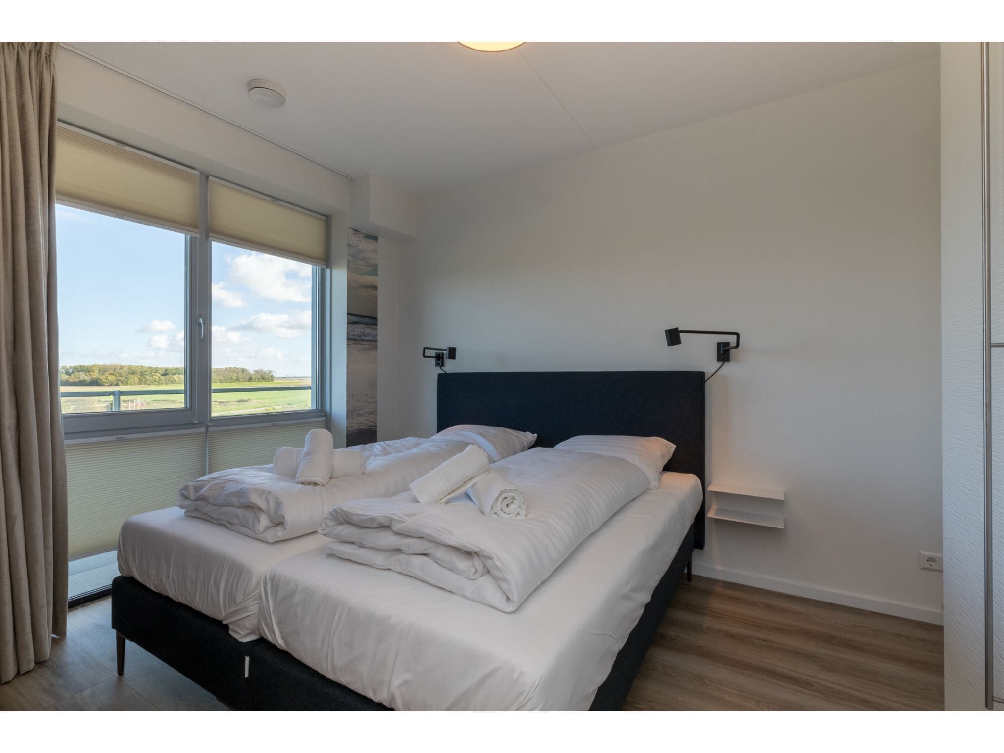 Een slaapkamer van De Zeester Gorishoeksedijk 41 in Scherpenisse