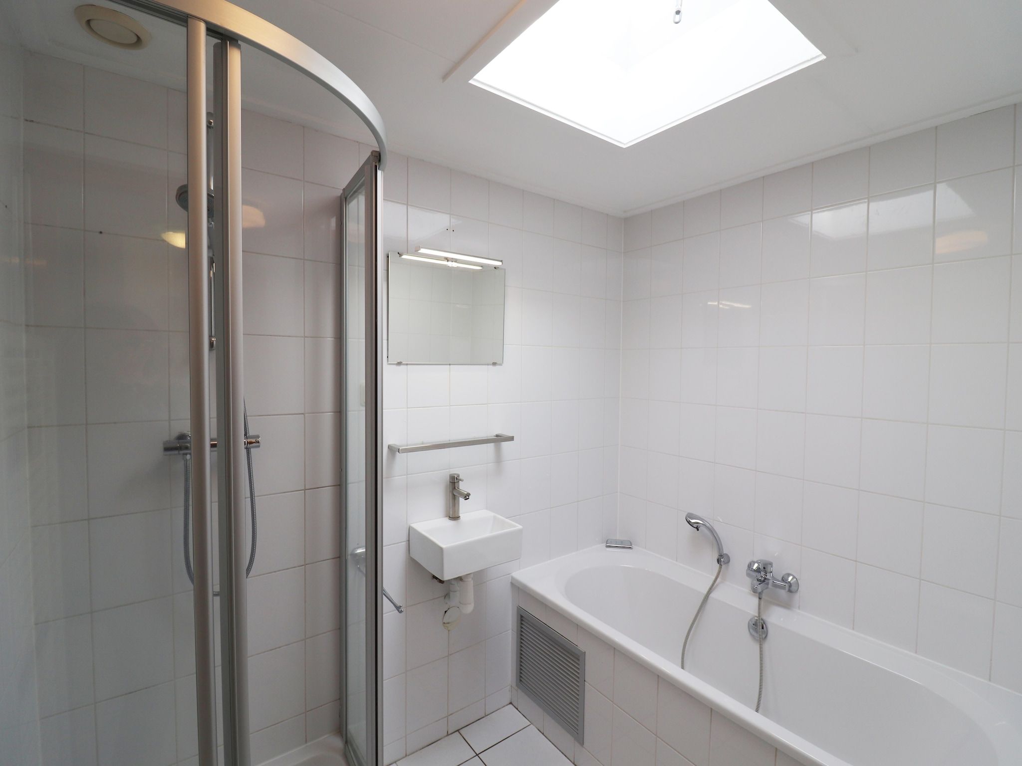 De badkamer van Golfvilla 40 Comfort in Hollum