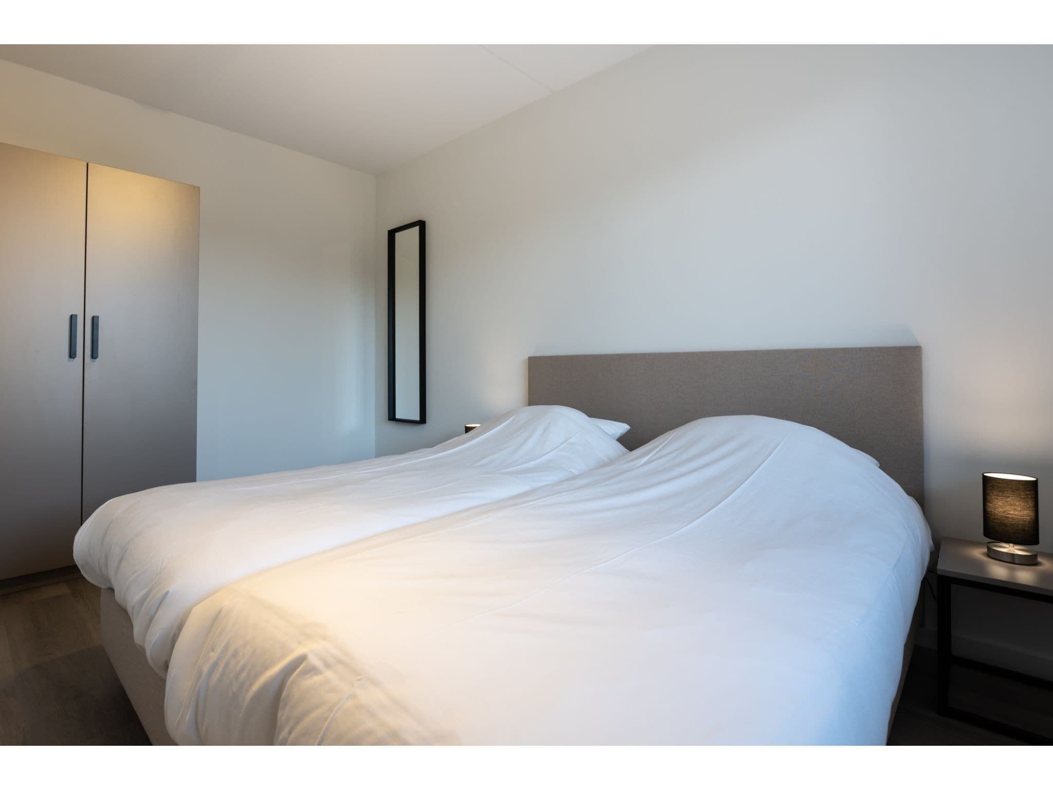 Een slaapkamer van Harbour Loft 1K Residence Marina havenzicht in Kamperland