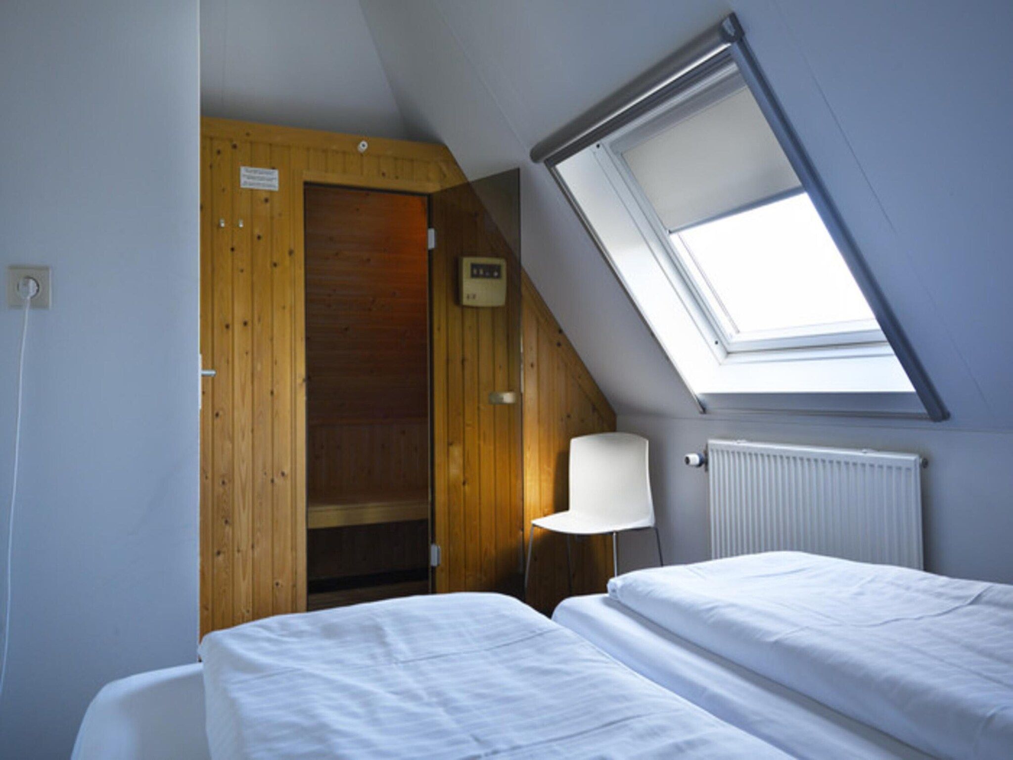 Een slaapkamer van Skip Wellness de luxe met sauna in Friesland