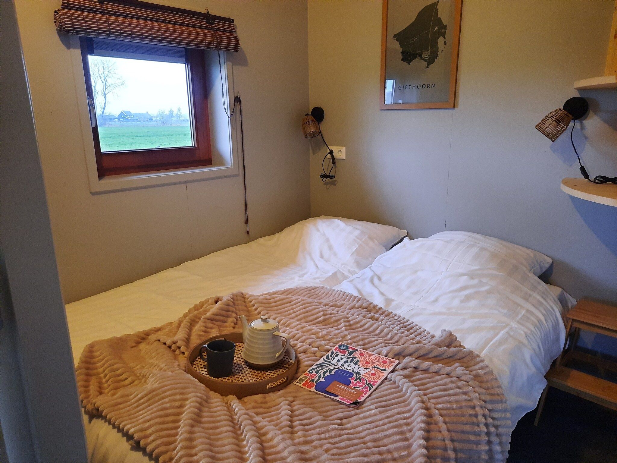 Een slaapkamer van Acker Lodges 1 in Ruinerwold