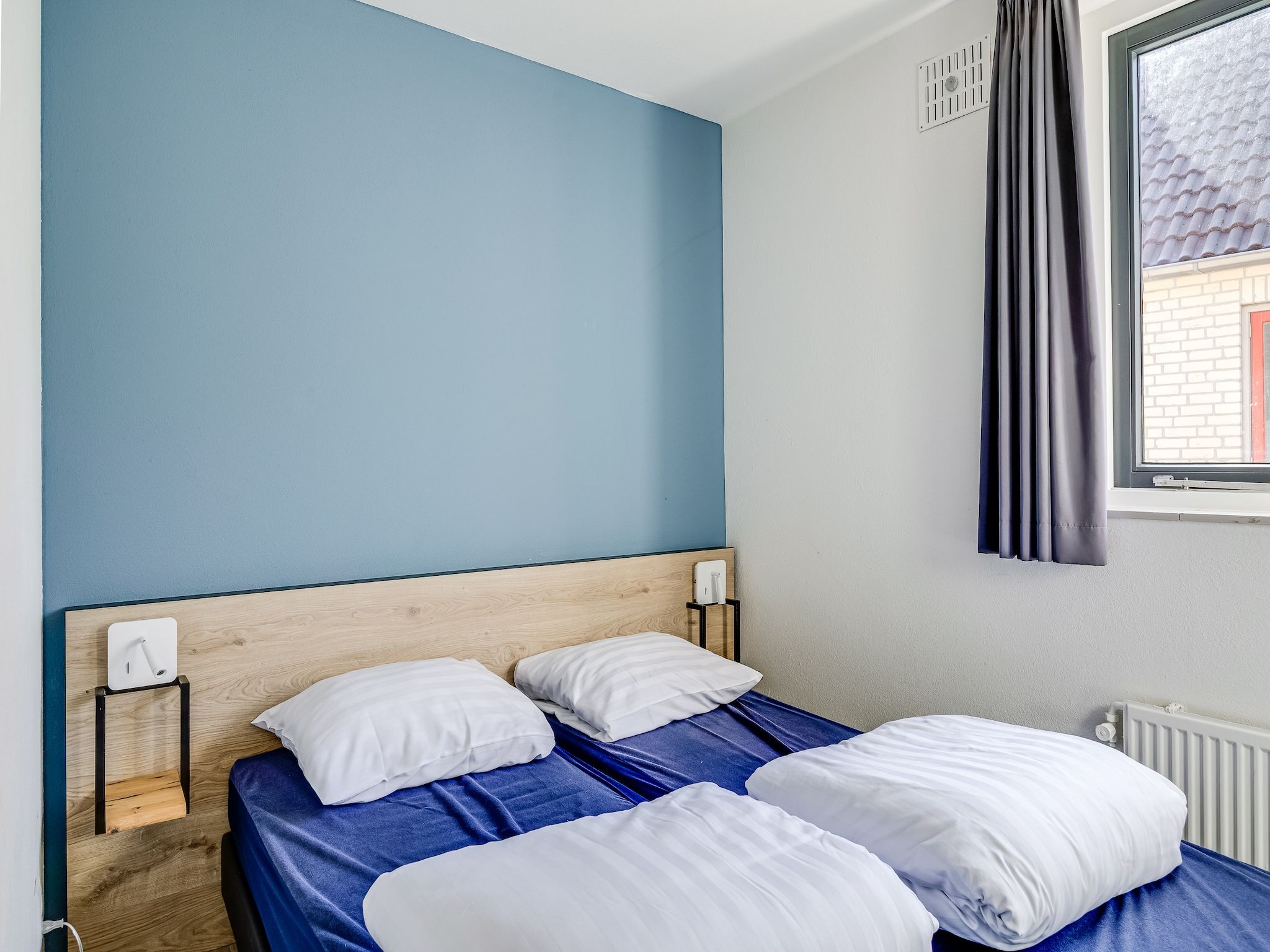 Een slaapkamer van Vakantiepark 't Broeckhuys 1 in Ewijk