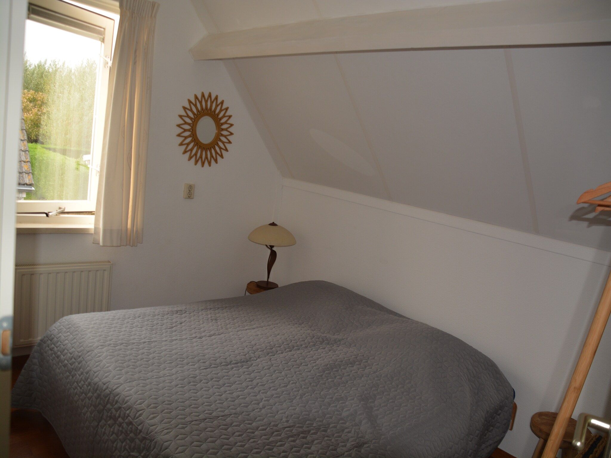 Een slaapkamer van Villapark De Oesterbaai 110 in Wemeldinge