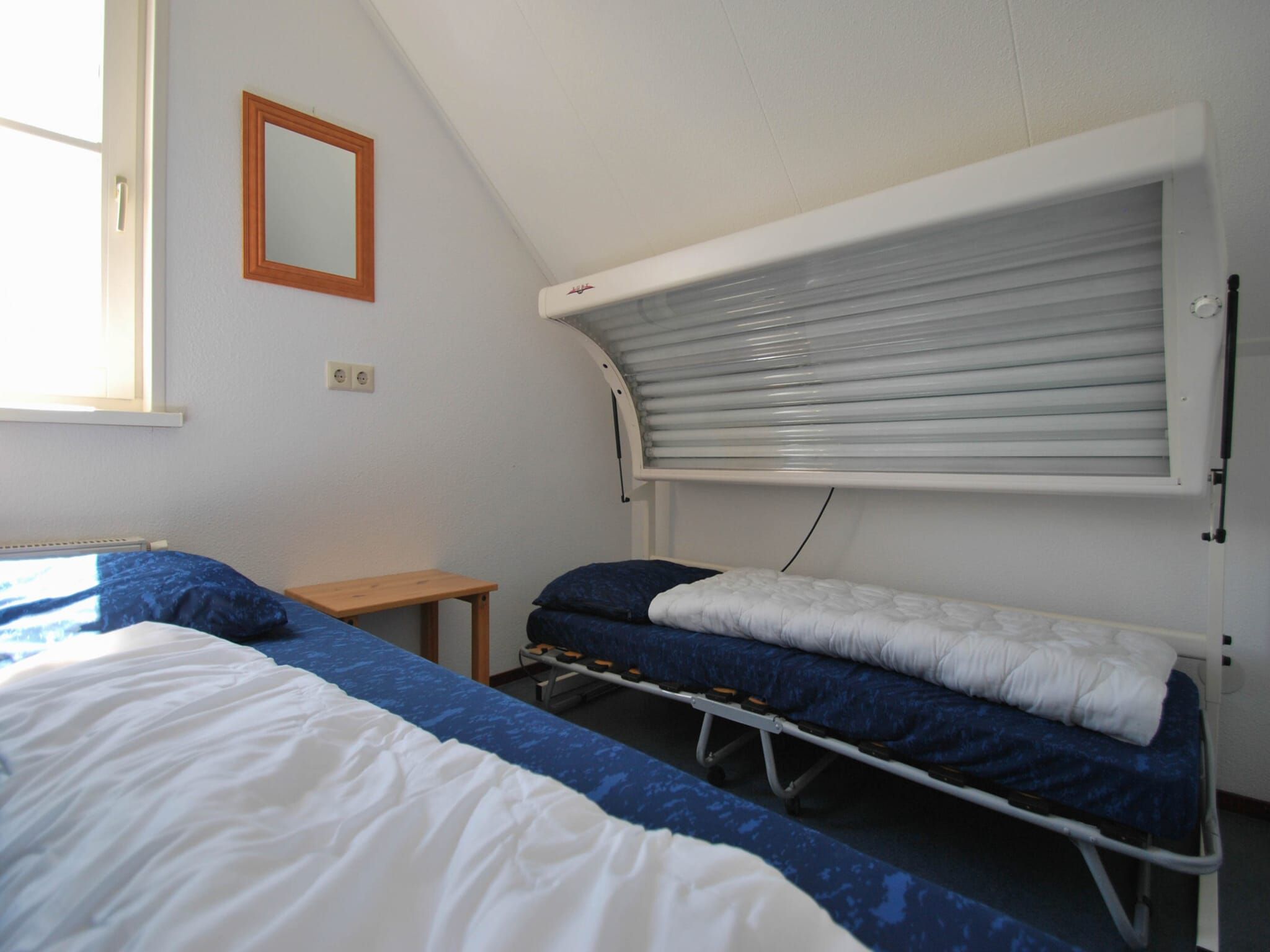 Een slaapkamer van Duinvilla - 4 personen in Makkum