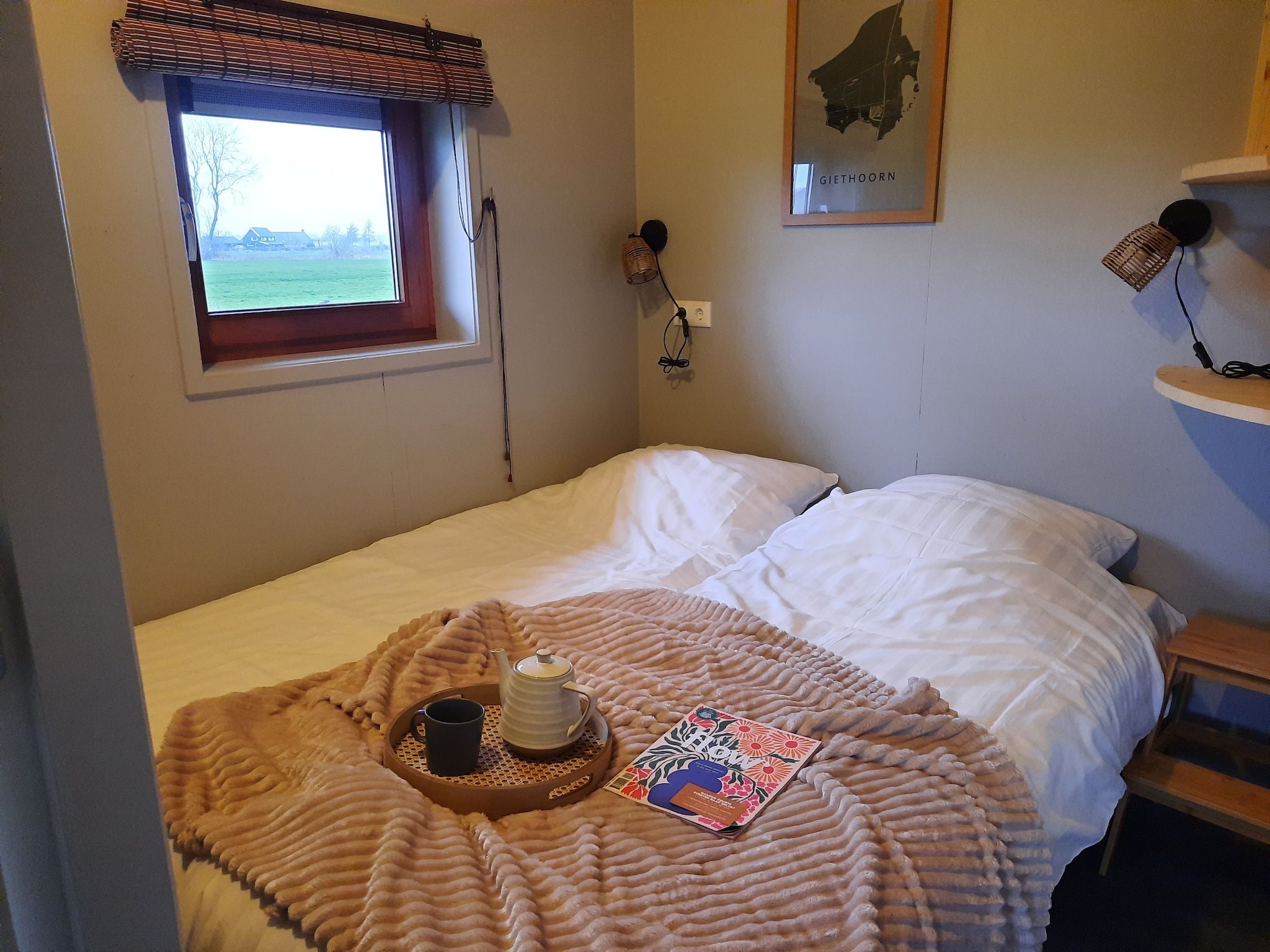 Een slaapkamer van Acker Lodges 3 in Ruinerwold
