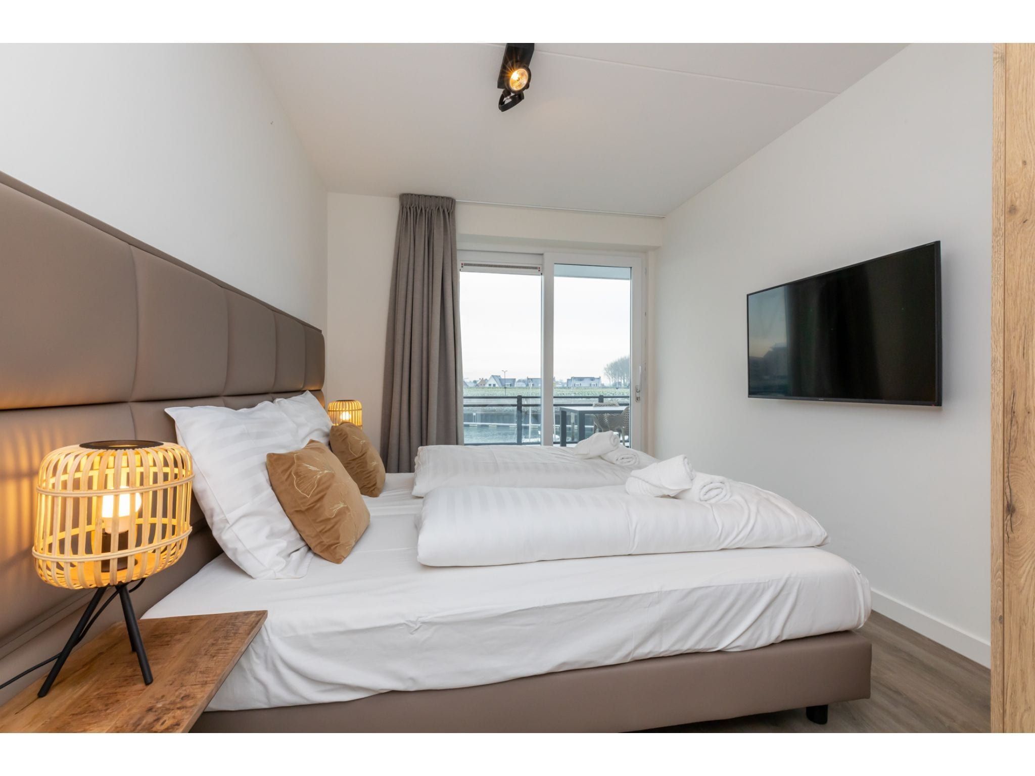 Een slaapkamer van Havenweg 8-14 in St. Annaland