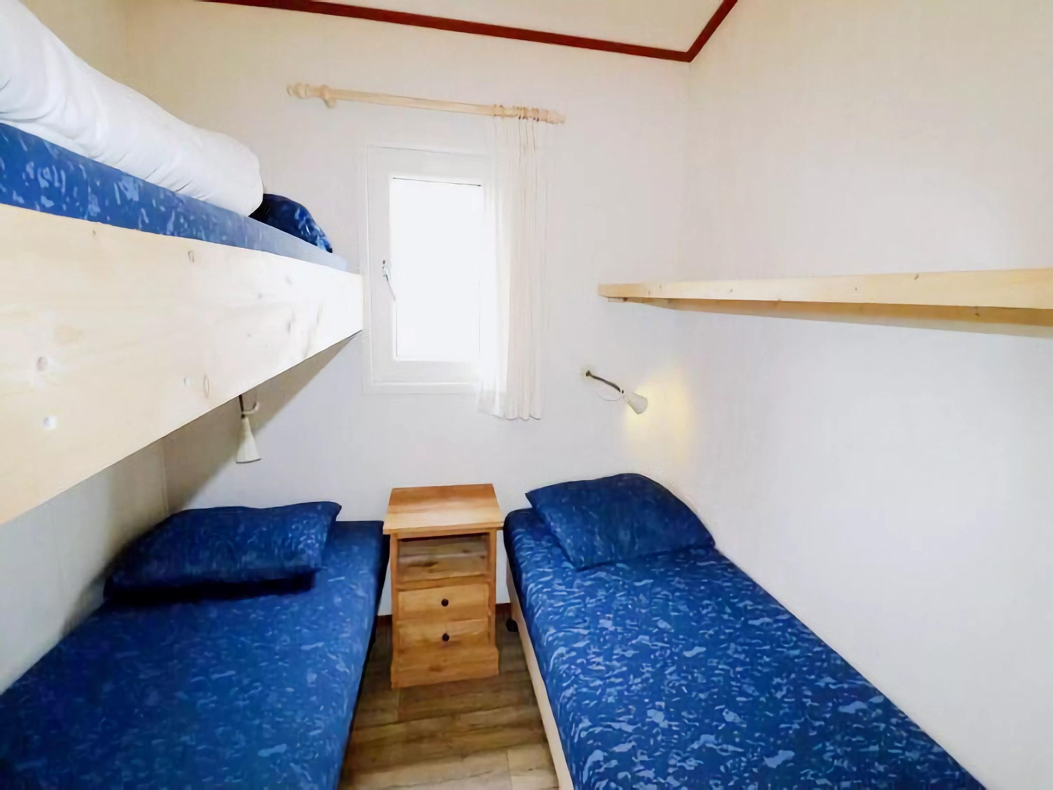 Een slaapkamer van Duinchalet in Hollum