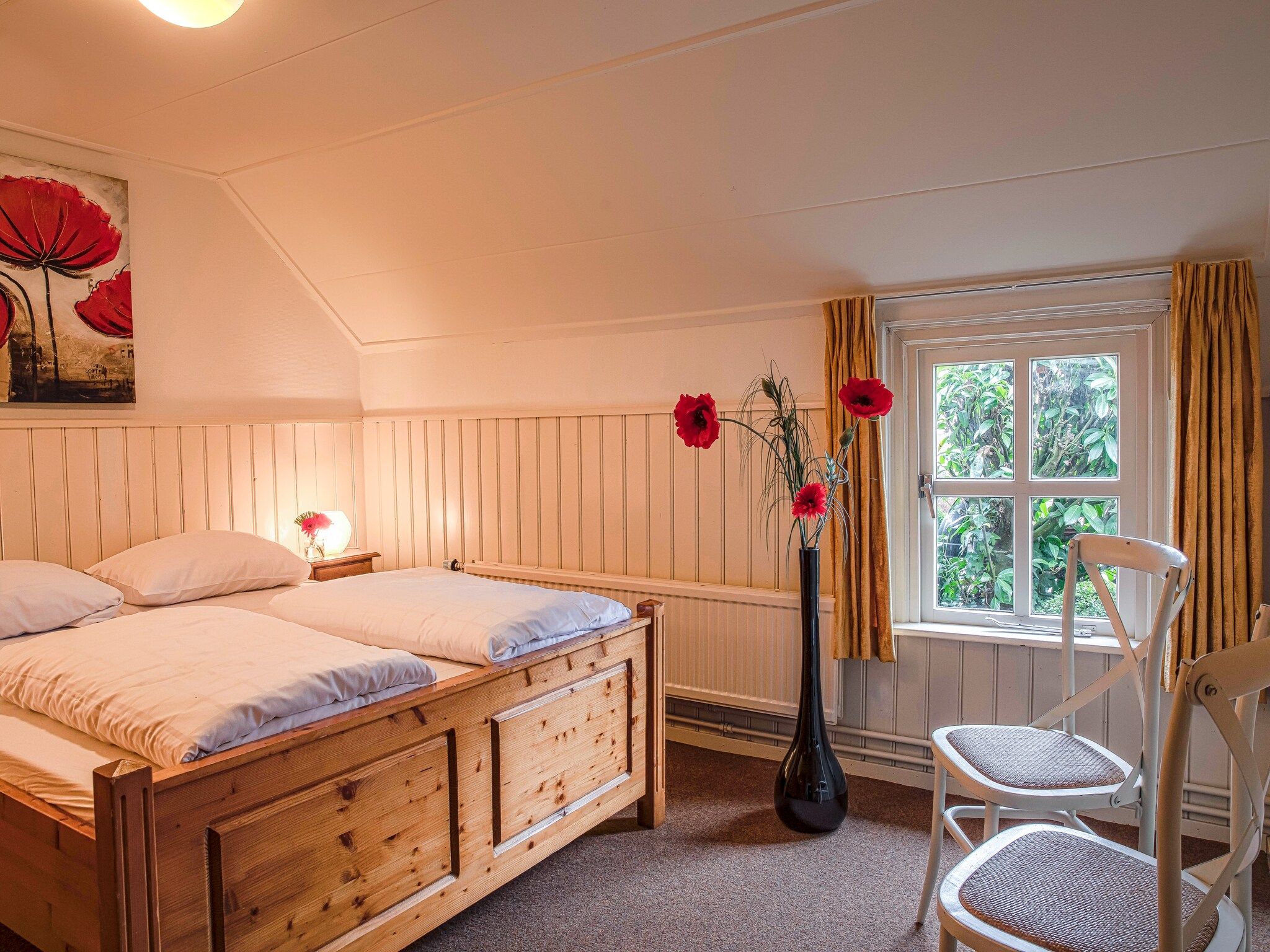 Een slaapkamer van De Familieboerderij in Losser