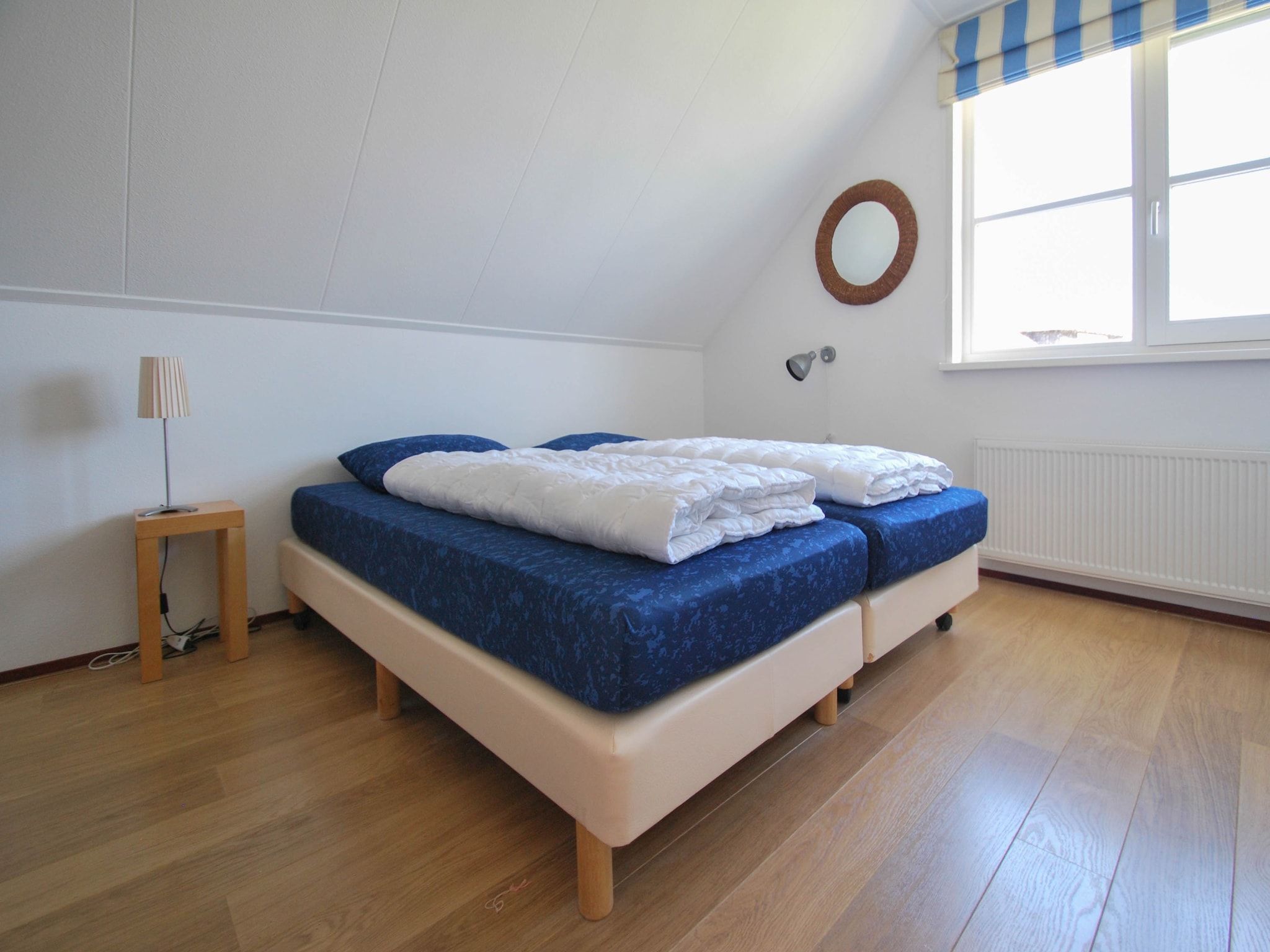 Een slaapkamer van Duinvilla - 6 personen in Makkum