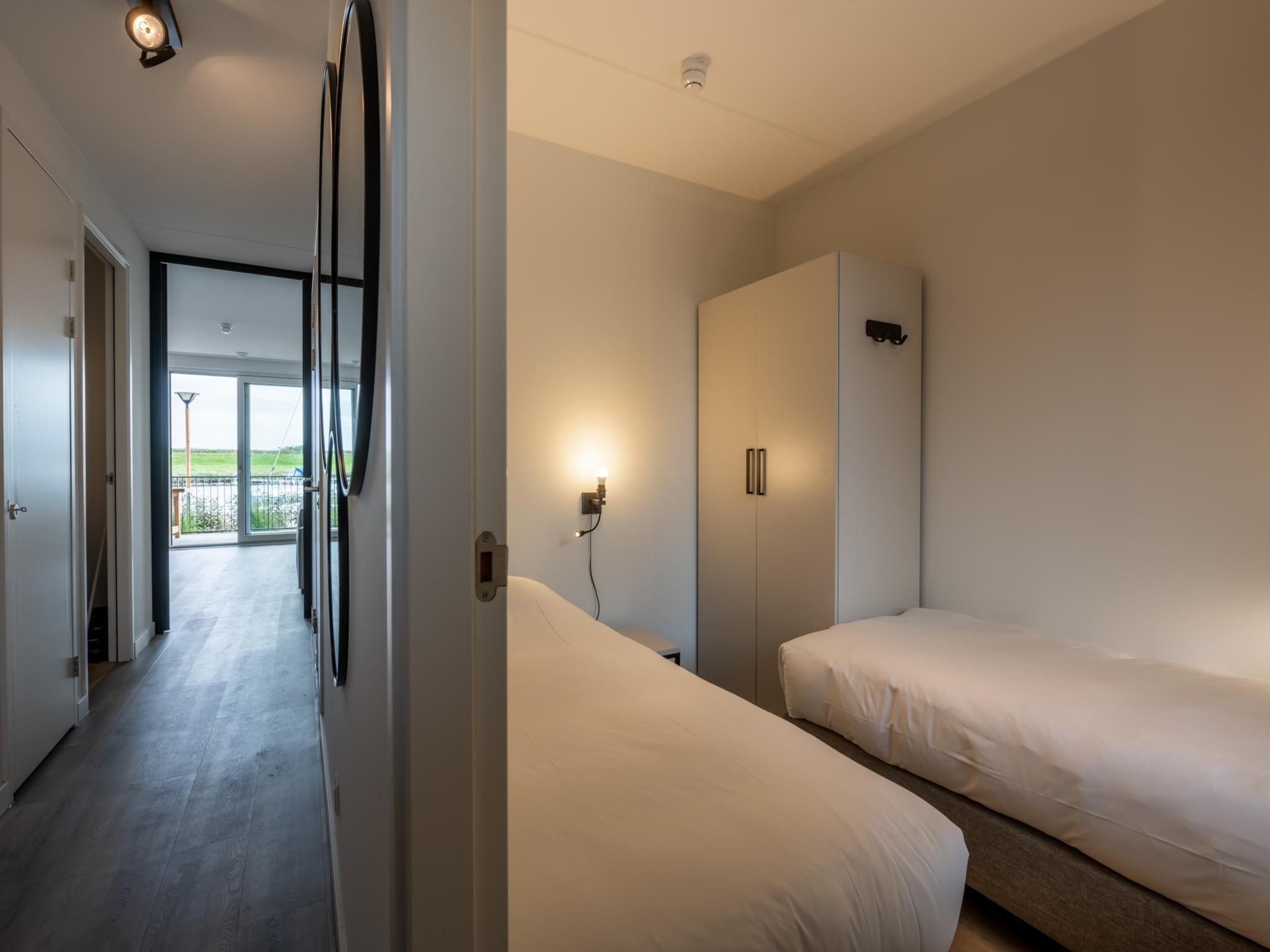 Een slaapkamer van Harbour Loft 1E Résidence Marina havenzicht in Kamperland