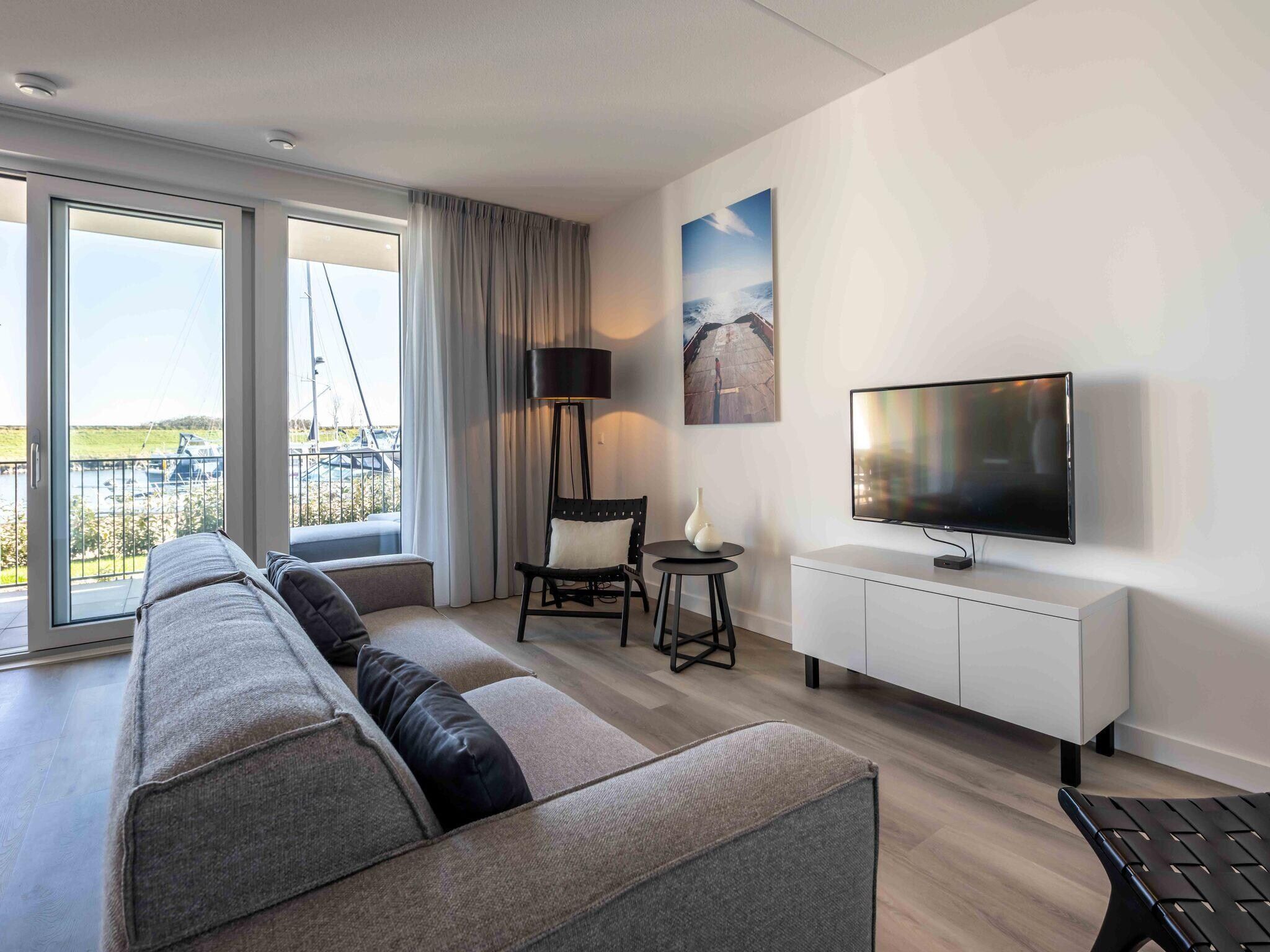 De woonkamer van Harbour Loft 1E Résidence Marina havenzicht in Kamperland