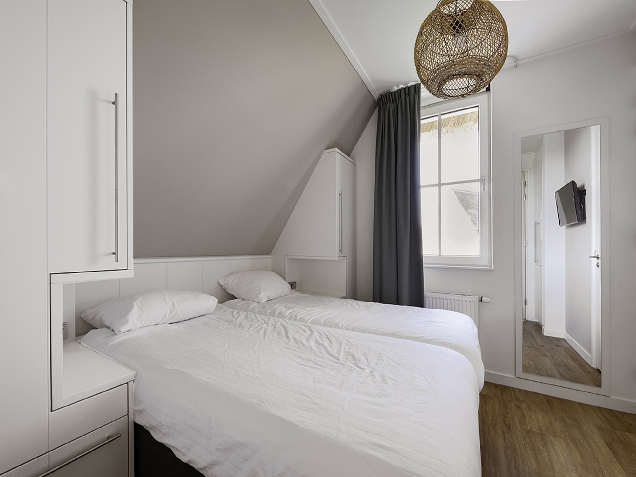 Een slaapkamer van Friese Meren Villa's 22 in Delfstrahuizen