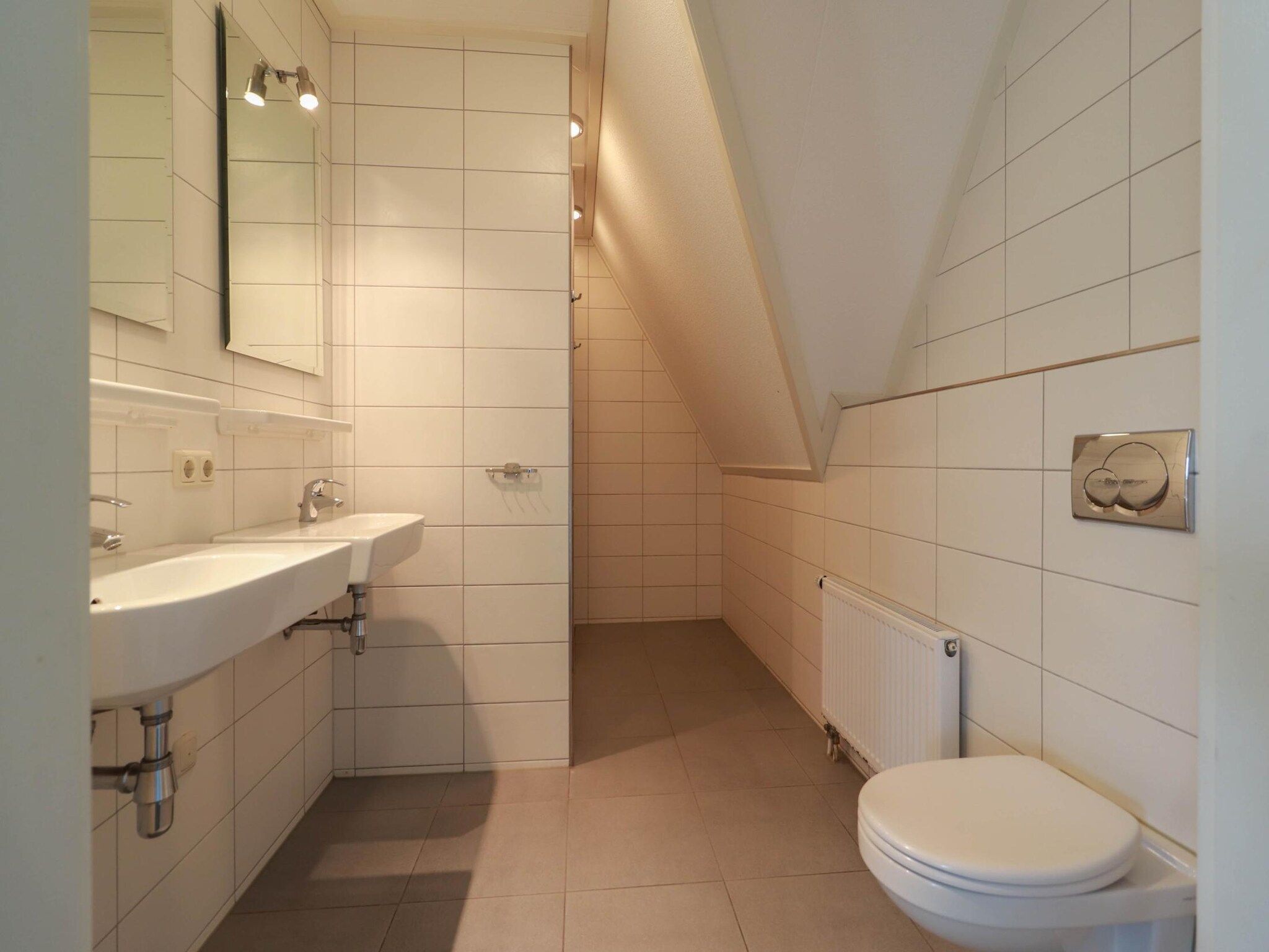 De badkamer van Beachvilla XL - 12 persons in Makkum