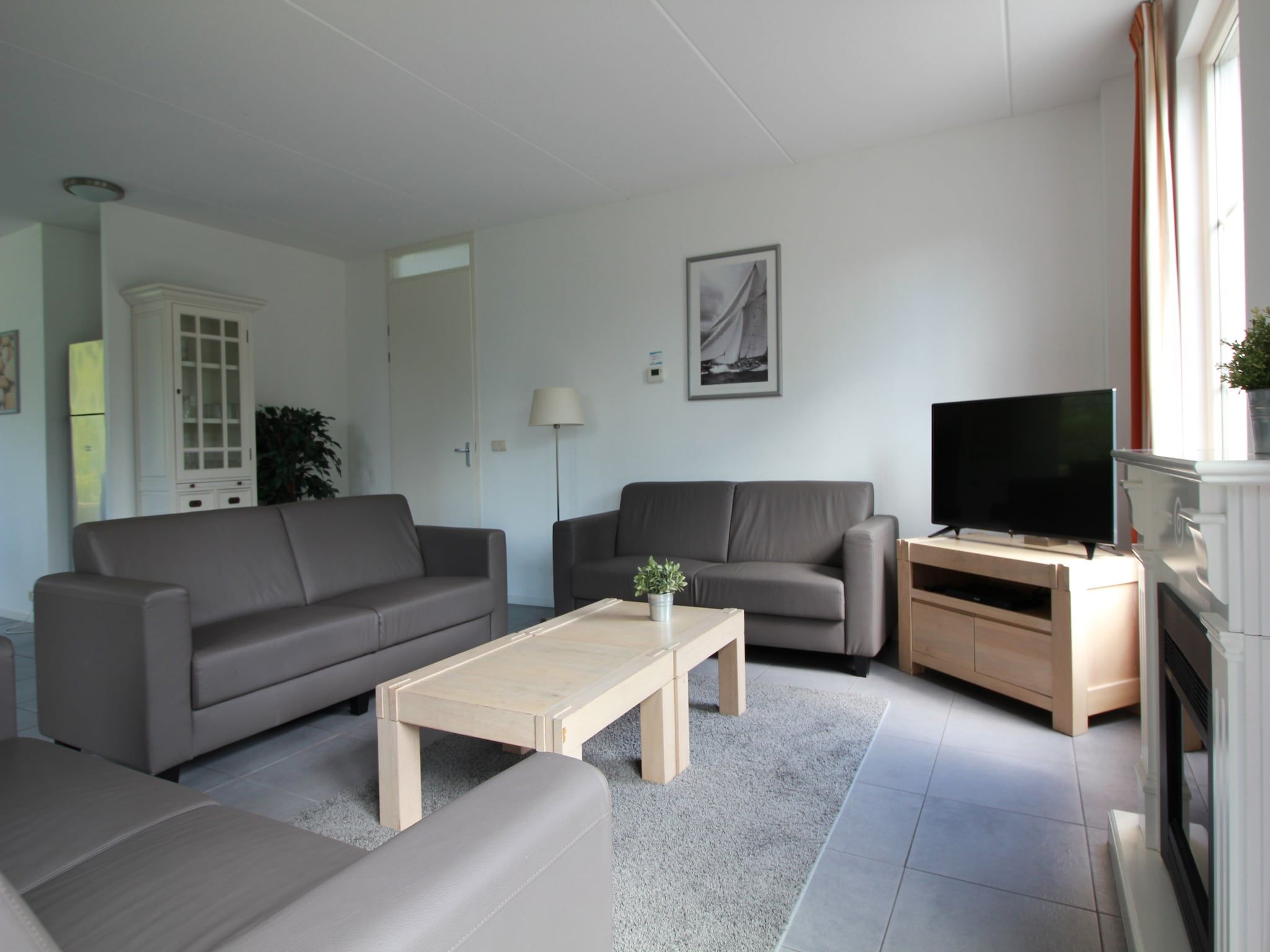 De woonkamer van Beachvilla XL - 12 persons in Makkum