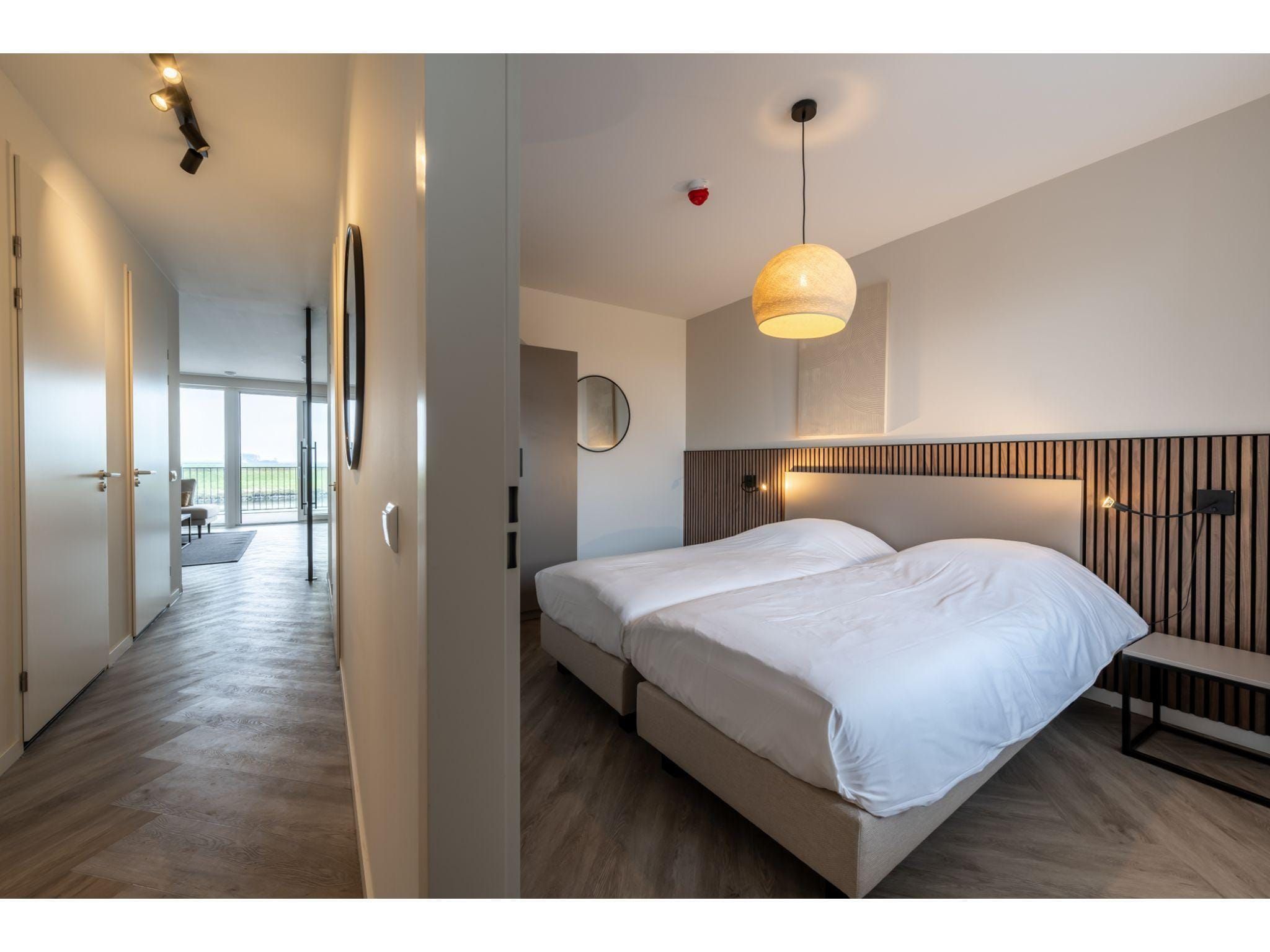 Een slaapkamer van Harbour Loft1J-havenzicht in Kamperland