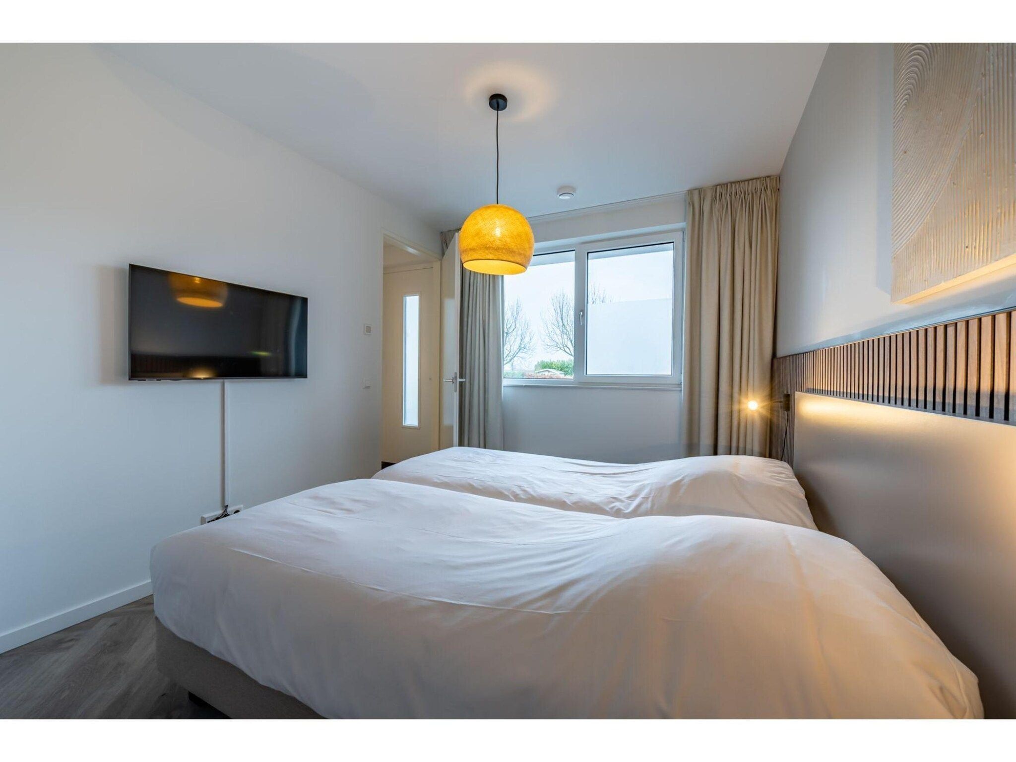 Een slaapkamer van Harbour Loft1J-havenzicht in Kamperland