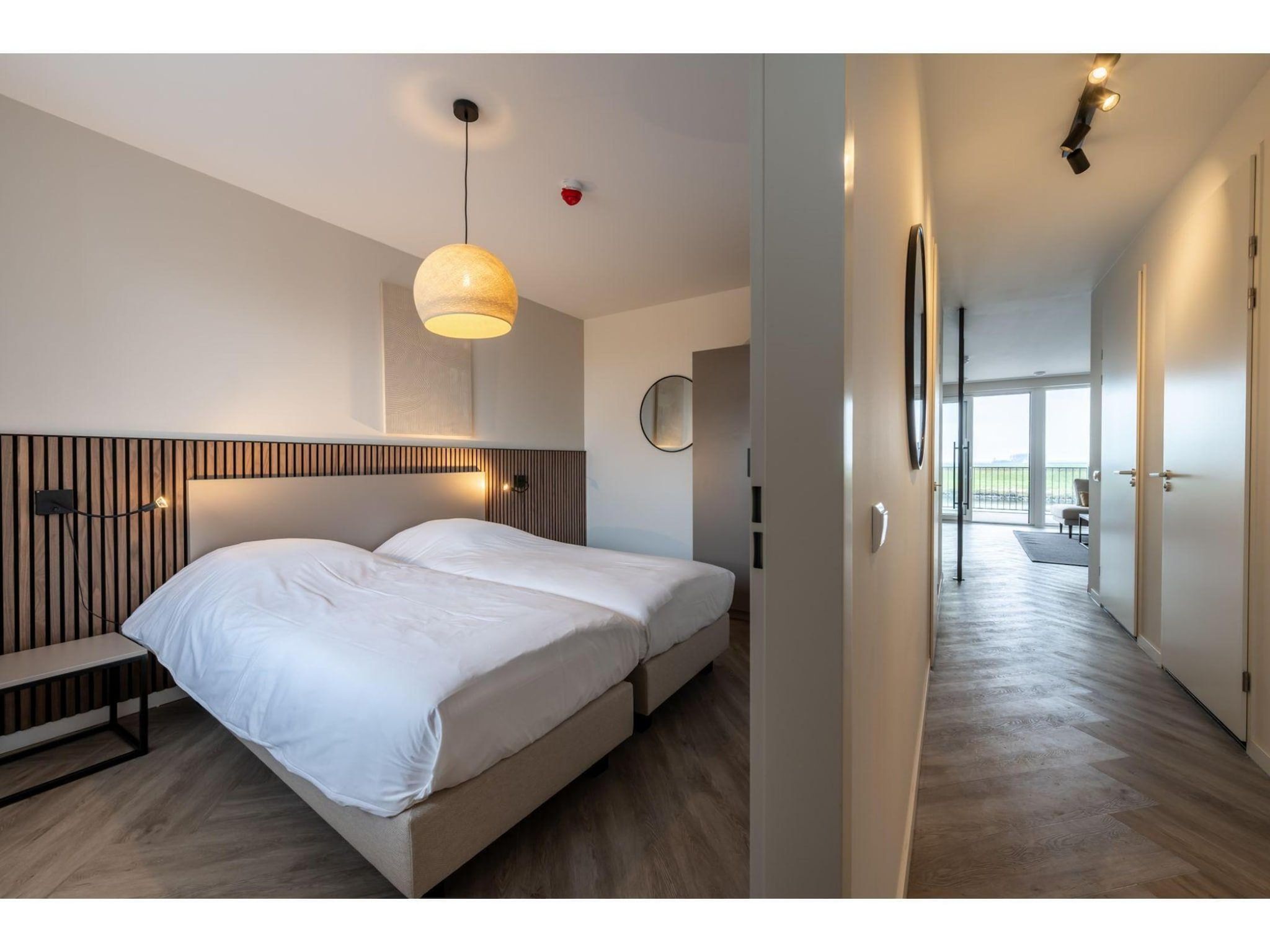 Een slaapkamer van Harbour Loft1J-havenzicht in Kamperland