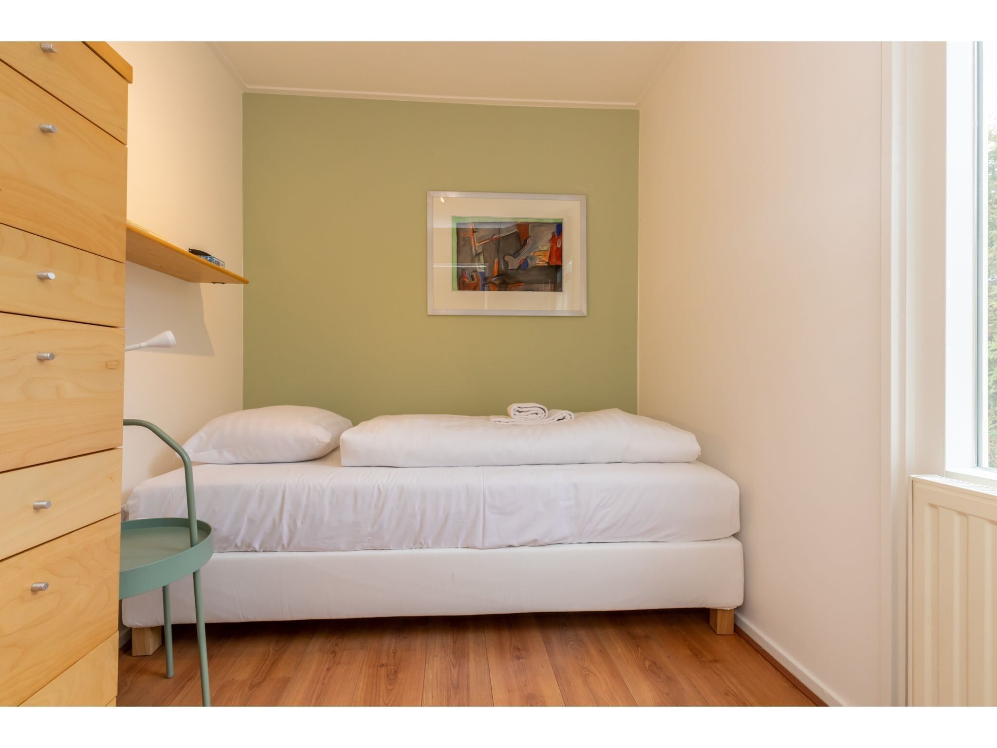 Een slaapkamer van Inlaag 31 in Wolphaartsdijk