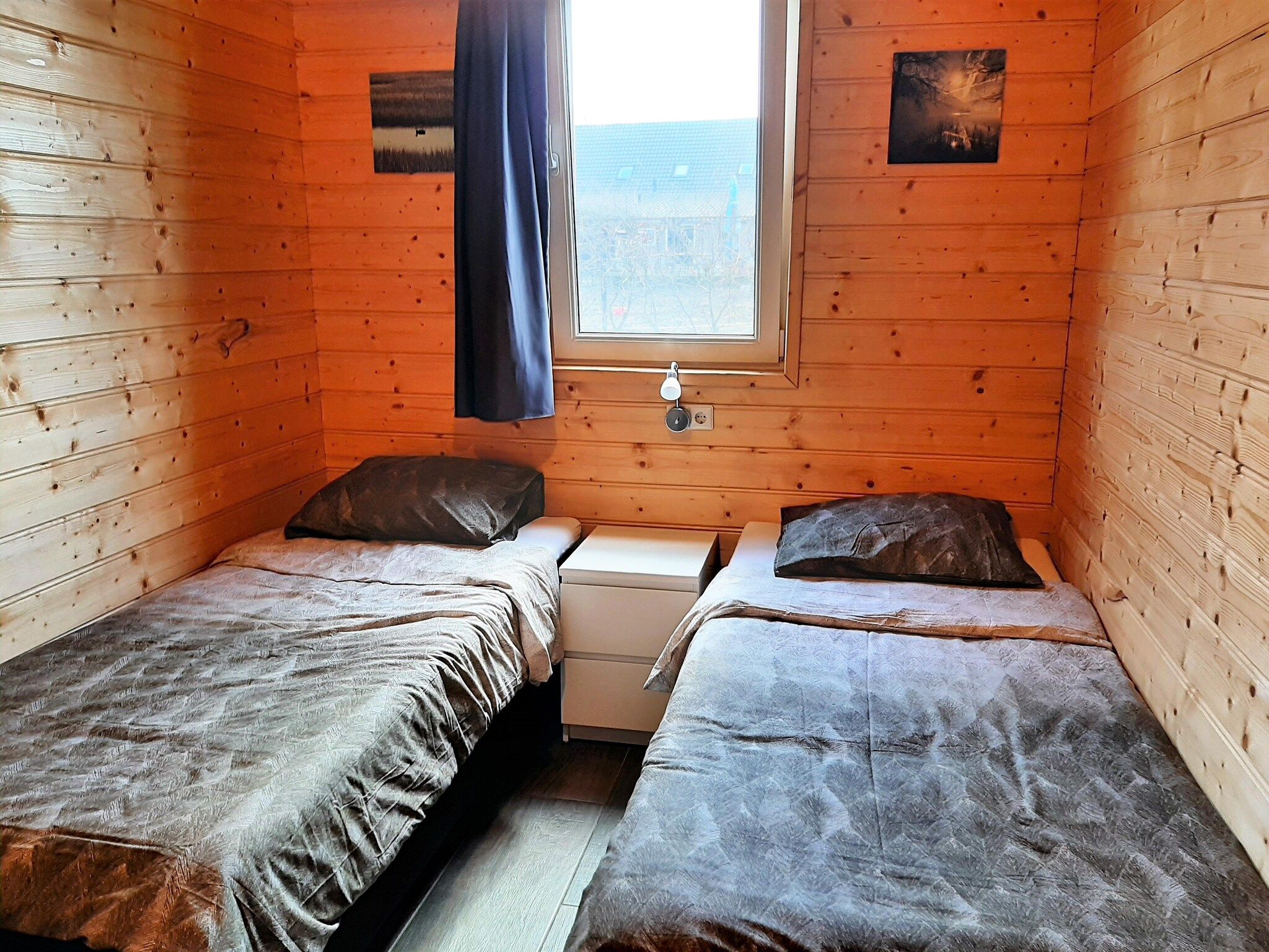 Een slaapkamer van Vakantiehuisje 19 in Someren-Heide