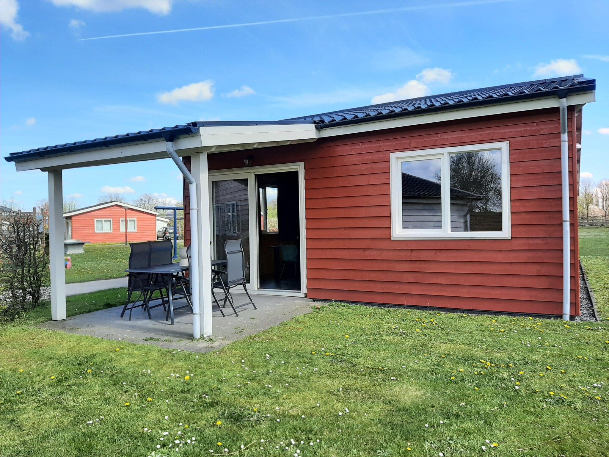 De tuin van Vakantiehuisje 19 in Someren-Heide