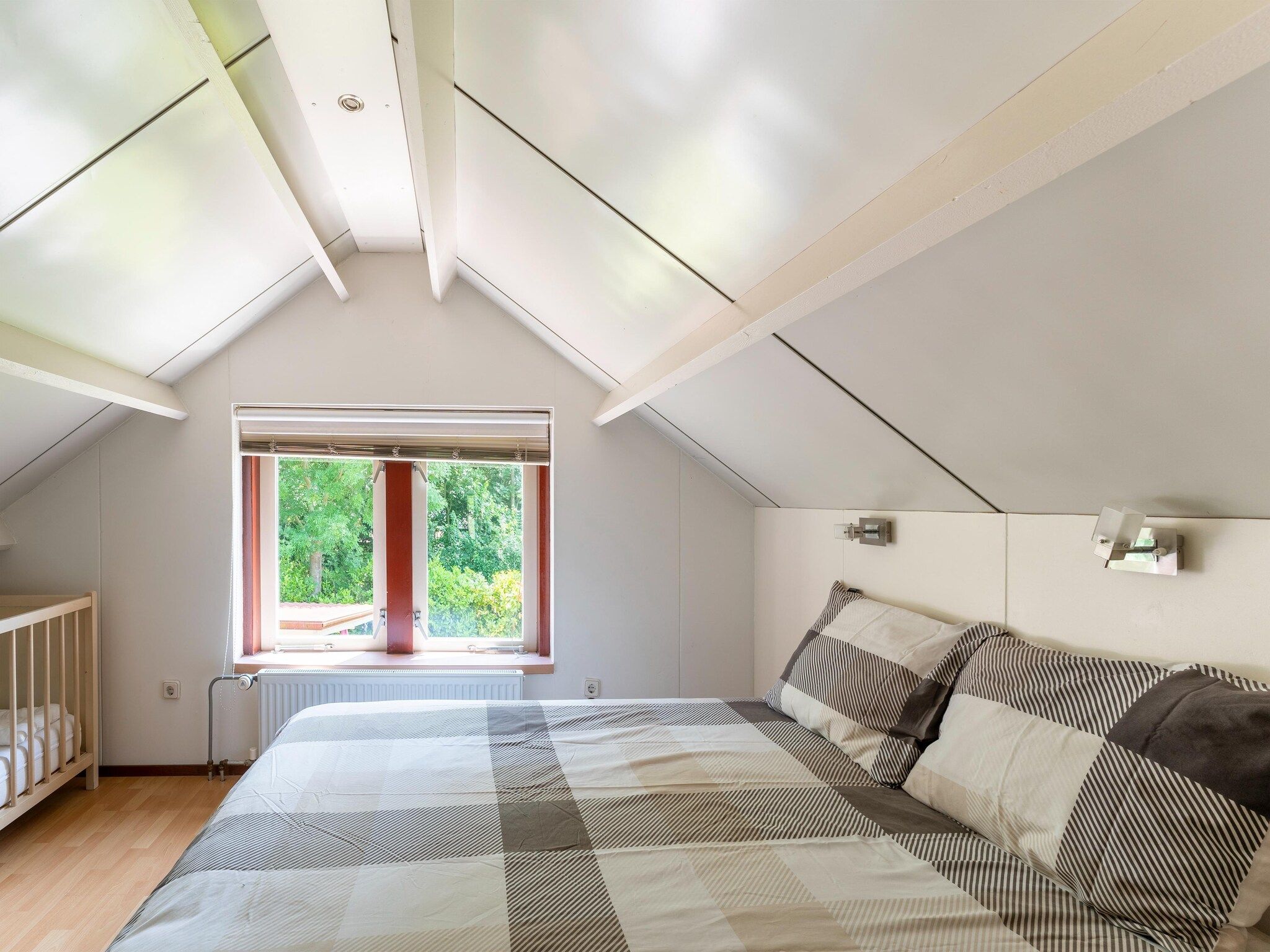 Een slaapkamer van Landingsweg 80 in Baarland