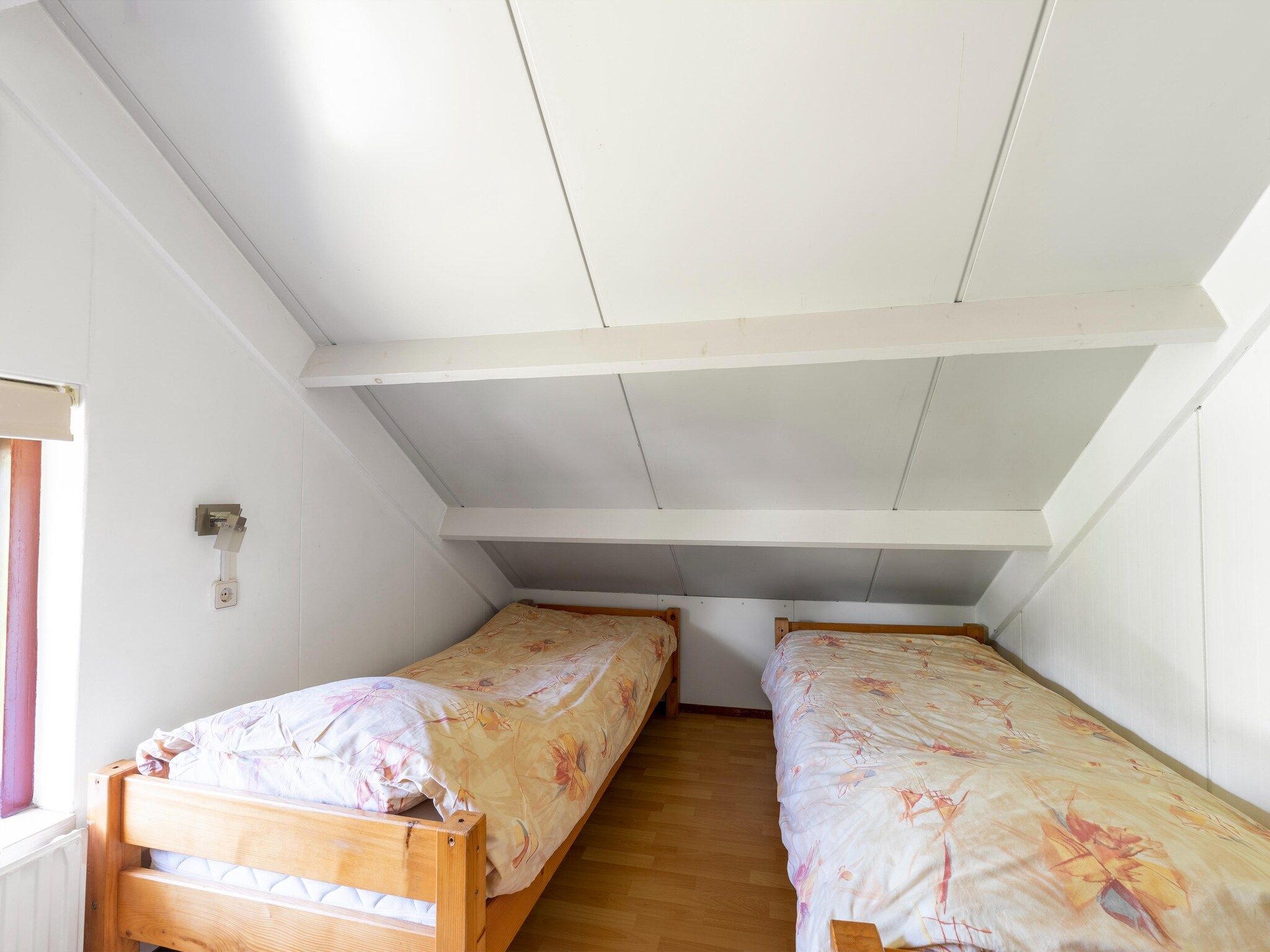 Een slaapkamer van Landingsweg 80 in Baarland
