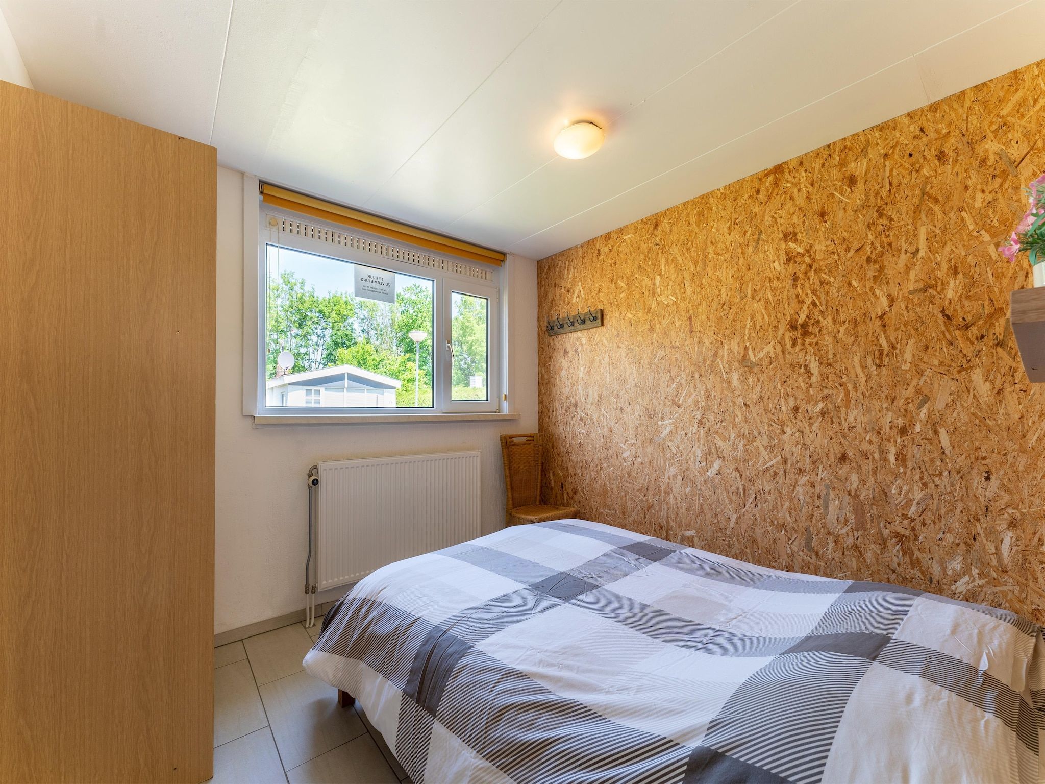 Een slaapkamer van Landingsweg 94 in Baarland