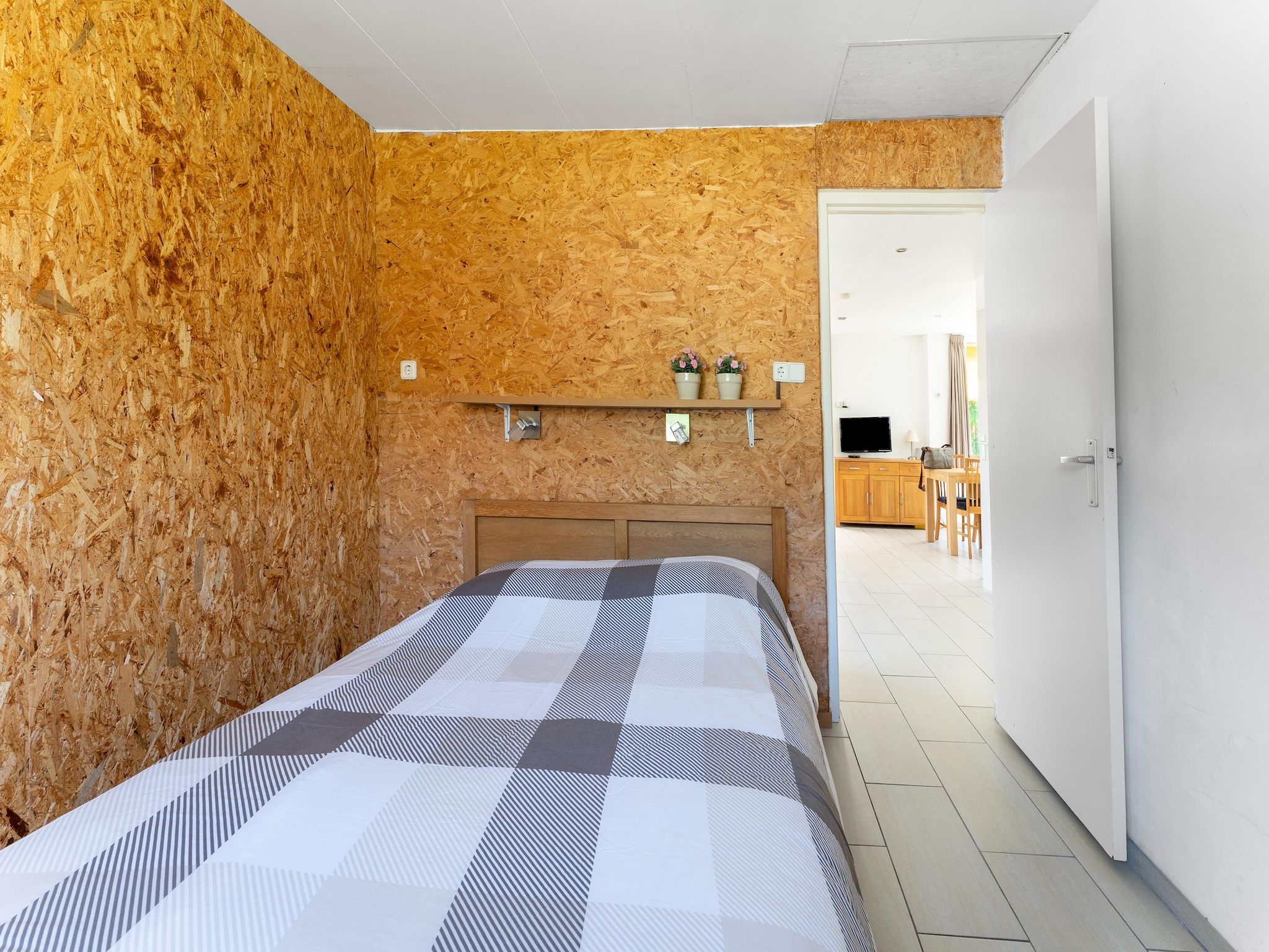 Een slaapkamer van Landingsweg 94 in Baarland