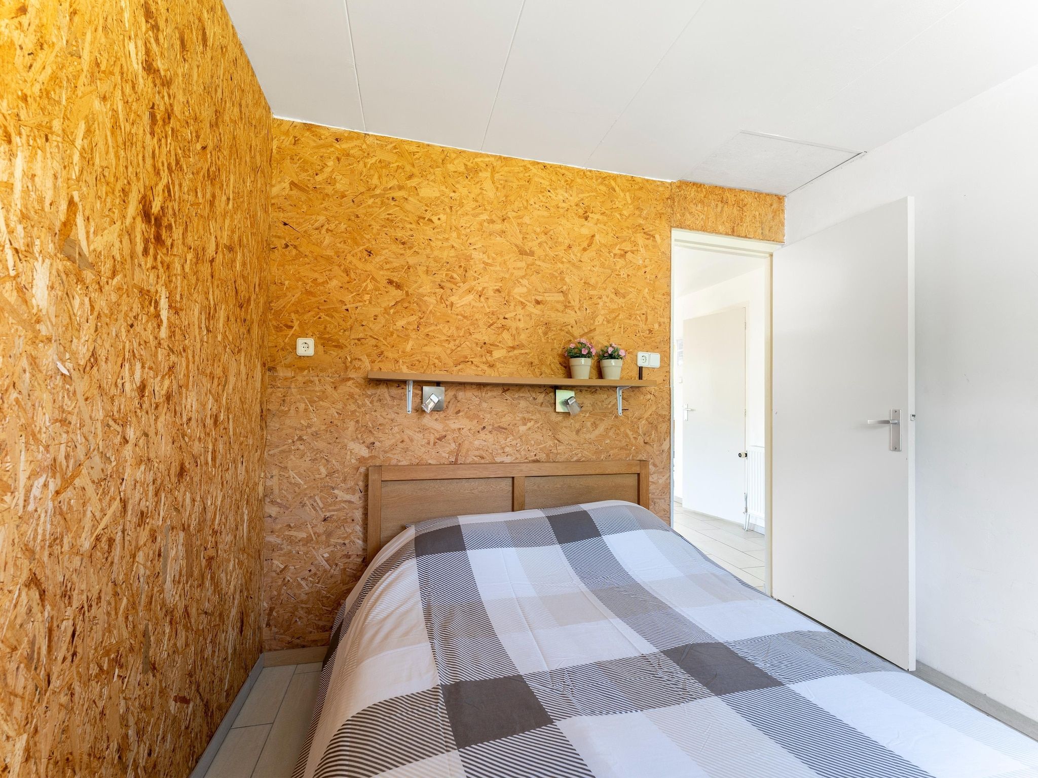 Een slaapkamer van Landingsweg 94 in Baarland