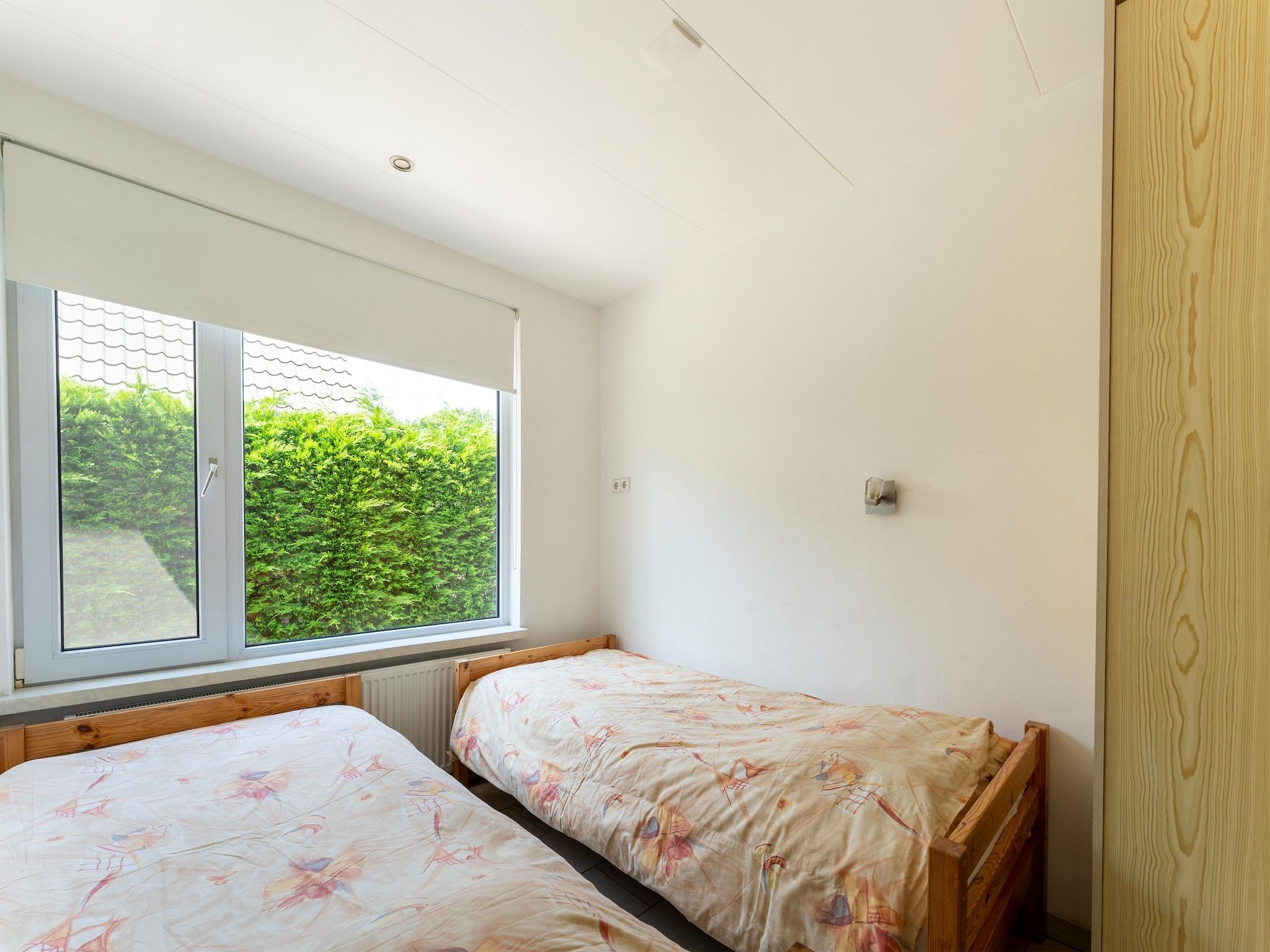 Een slaapkamer van Landingsweg 94 in Baarland