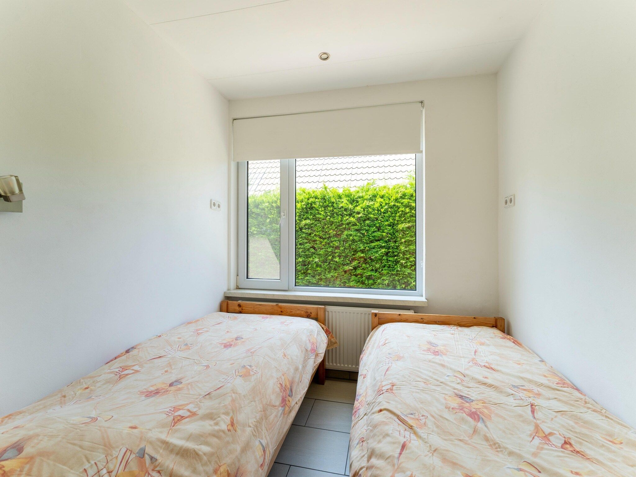 Een slaapkamer van Landingsweg 94 in Baarland