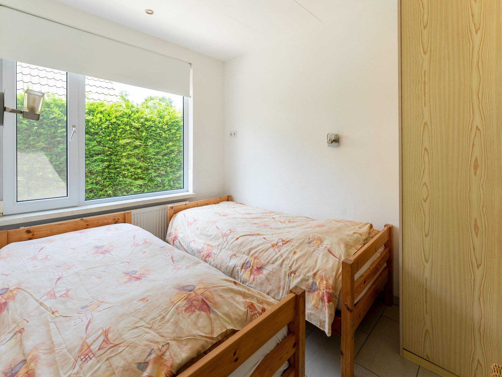 Een slaapkamer van Landingsweg 94 in Baarland