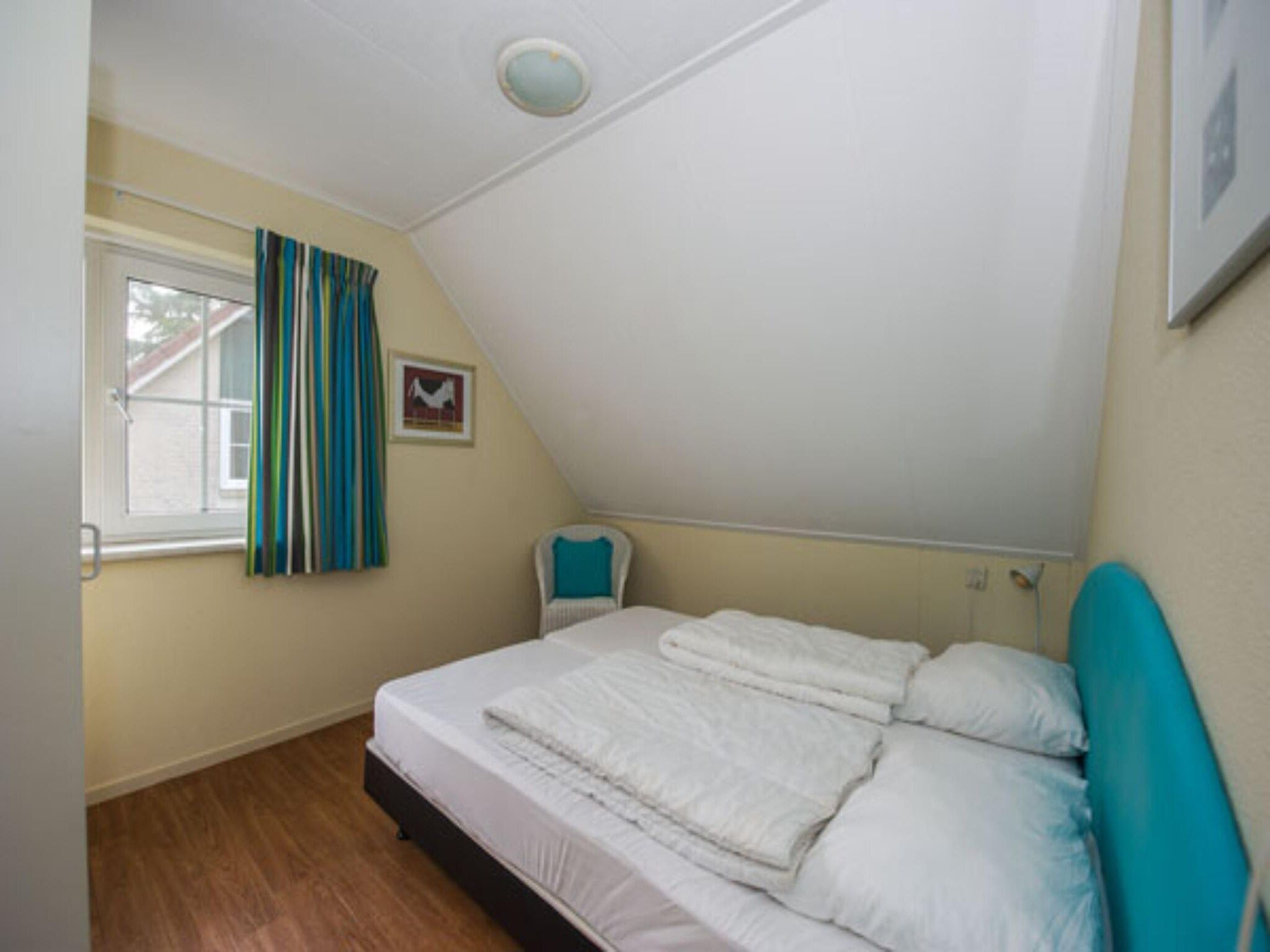 Een slaapkamer van Vakantiepark Hellendoorn 2 in Hellendoorn