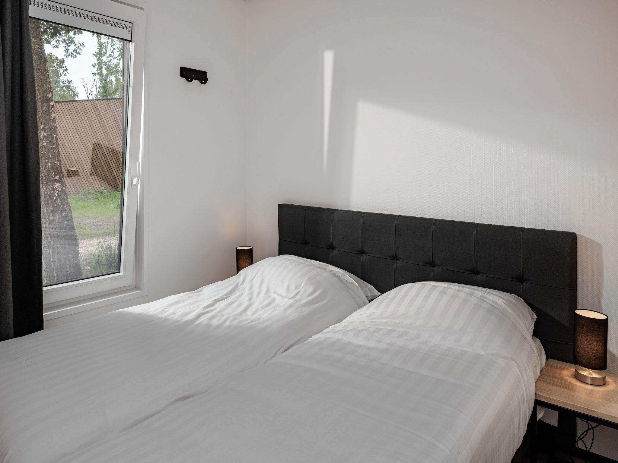 Een slaapkamer van Vakantiepark Schaijk 12 in Schaijk