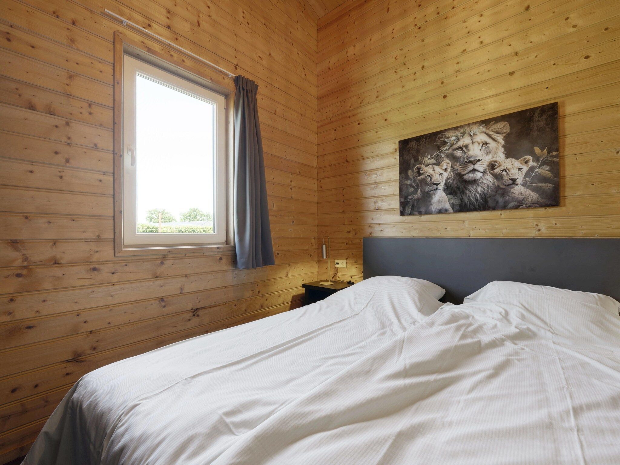 Een slaapkamer van Vakantiehuisje 20 in Someren-Heide