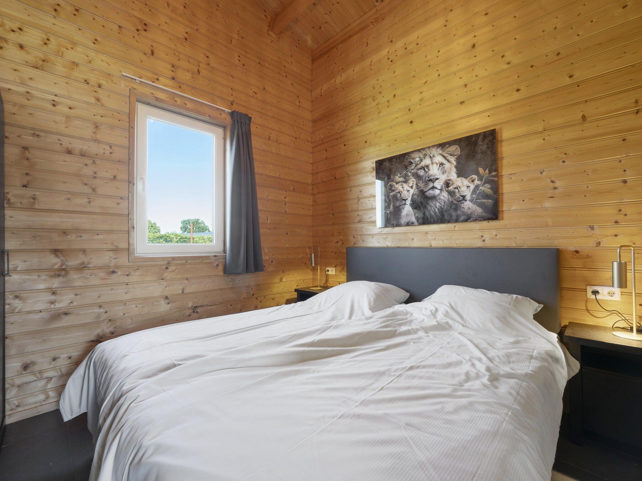 Een slaapkamer van Vakantiehuisje 20 in Someren-Heide