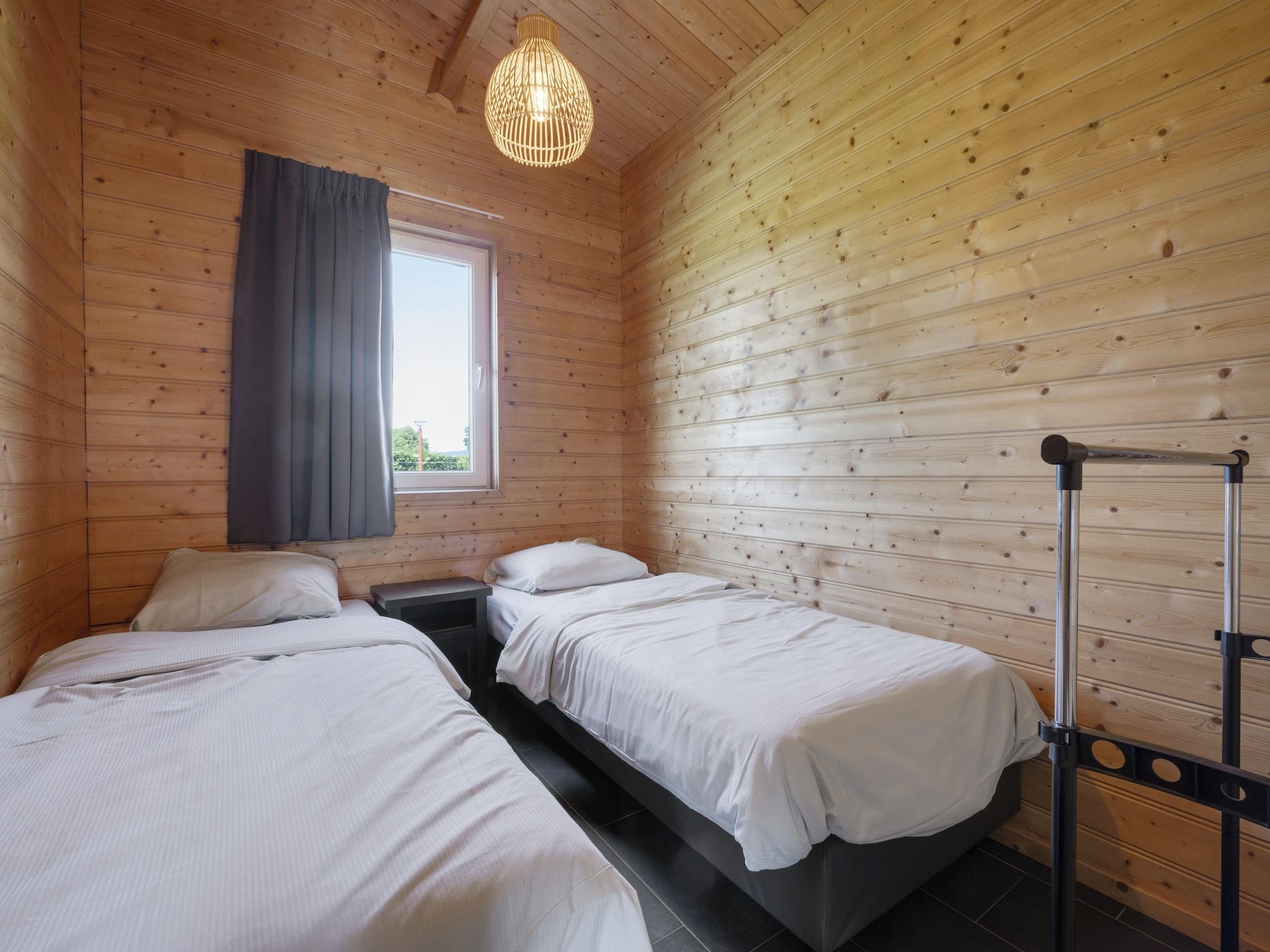 Een slaapkamer van Vakantiehuisje 20 in Someren-Heide
