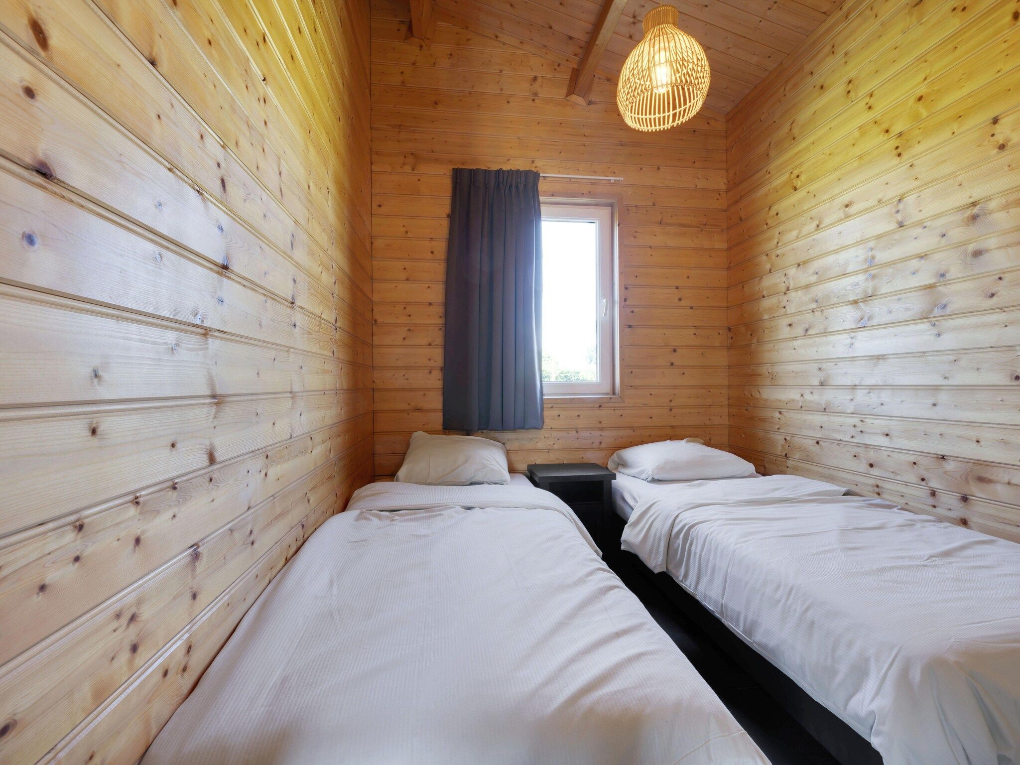 Een slaapkamer van Vakantiehuisje 20 in Someren-Heide