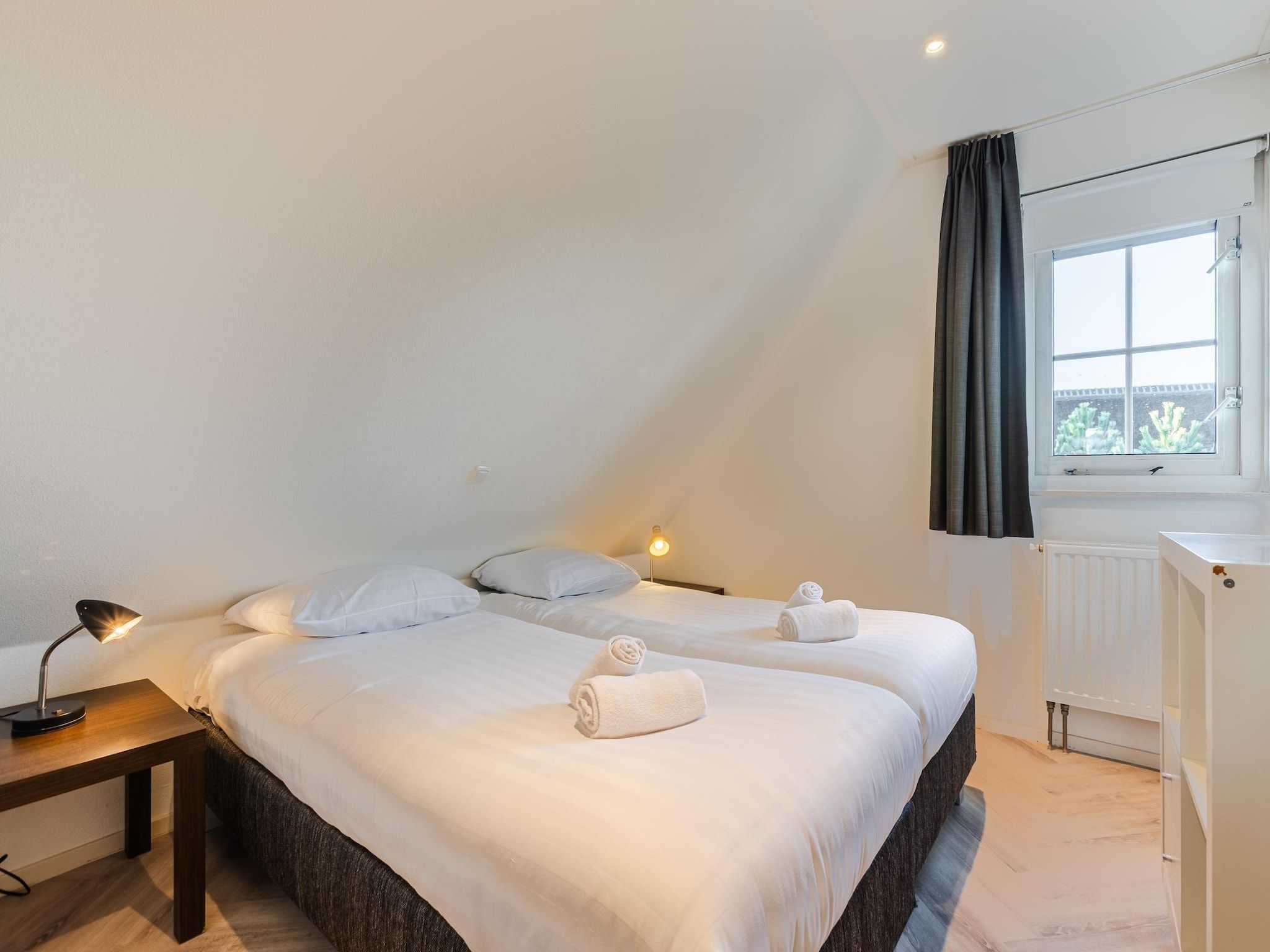Een slaapkamer van Boomhiemke Engelsmanduinvilla 6 in Hollum