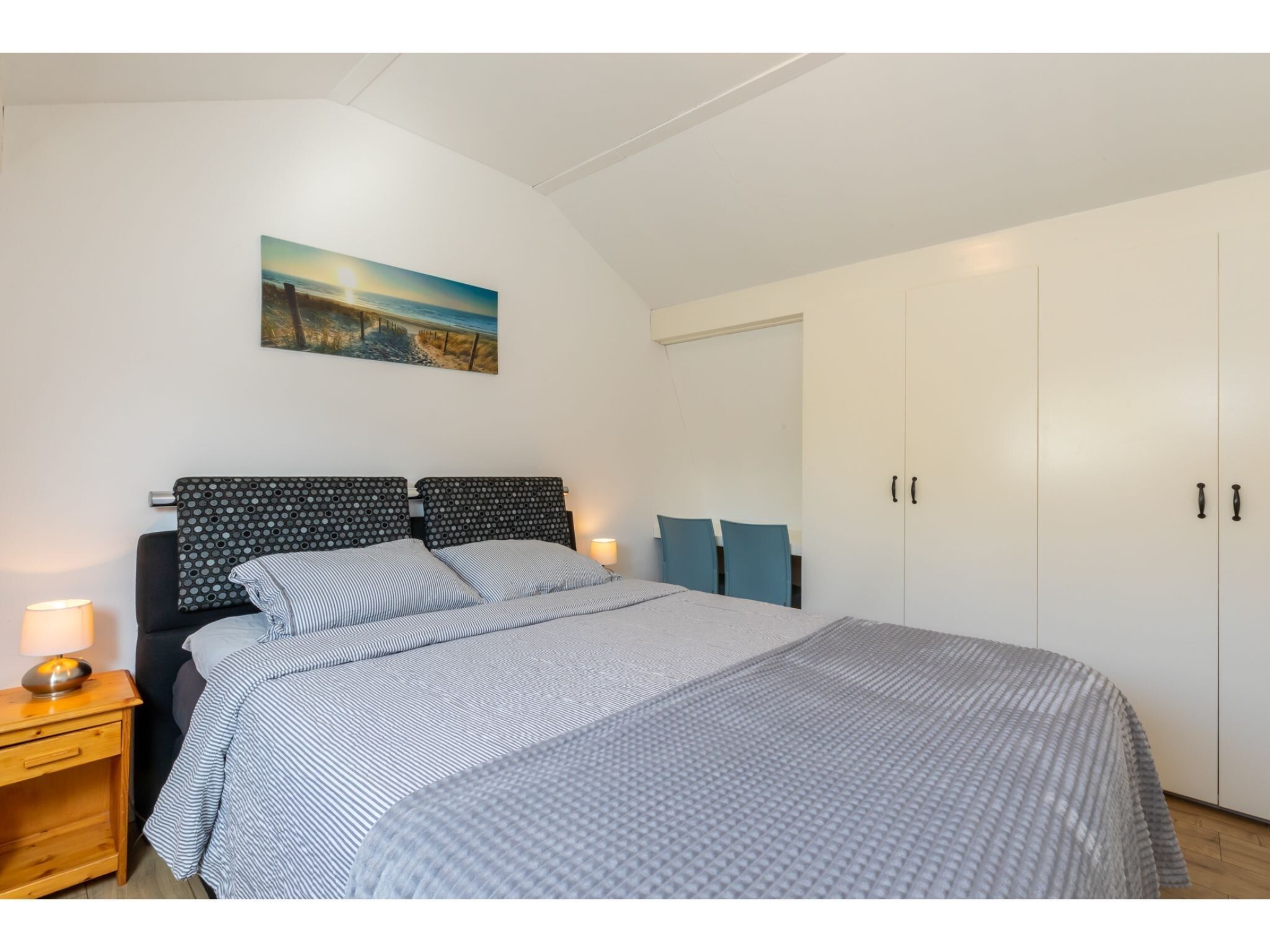 Een slaapkamer van Kanonweistraat 11a in Domburg