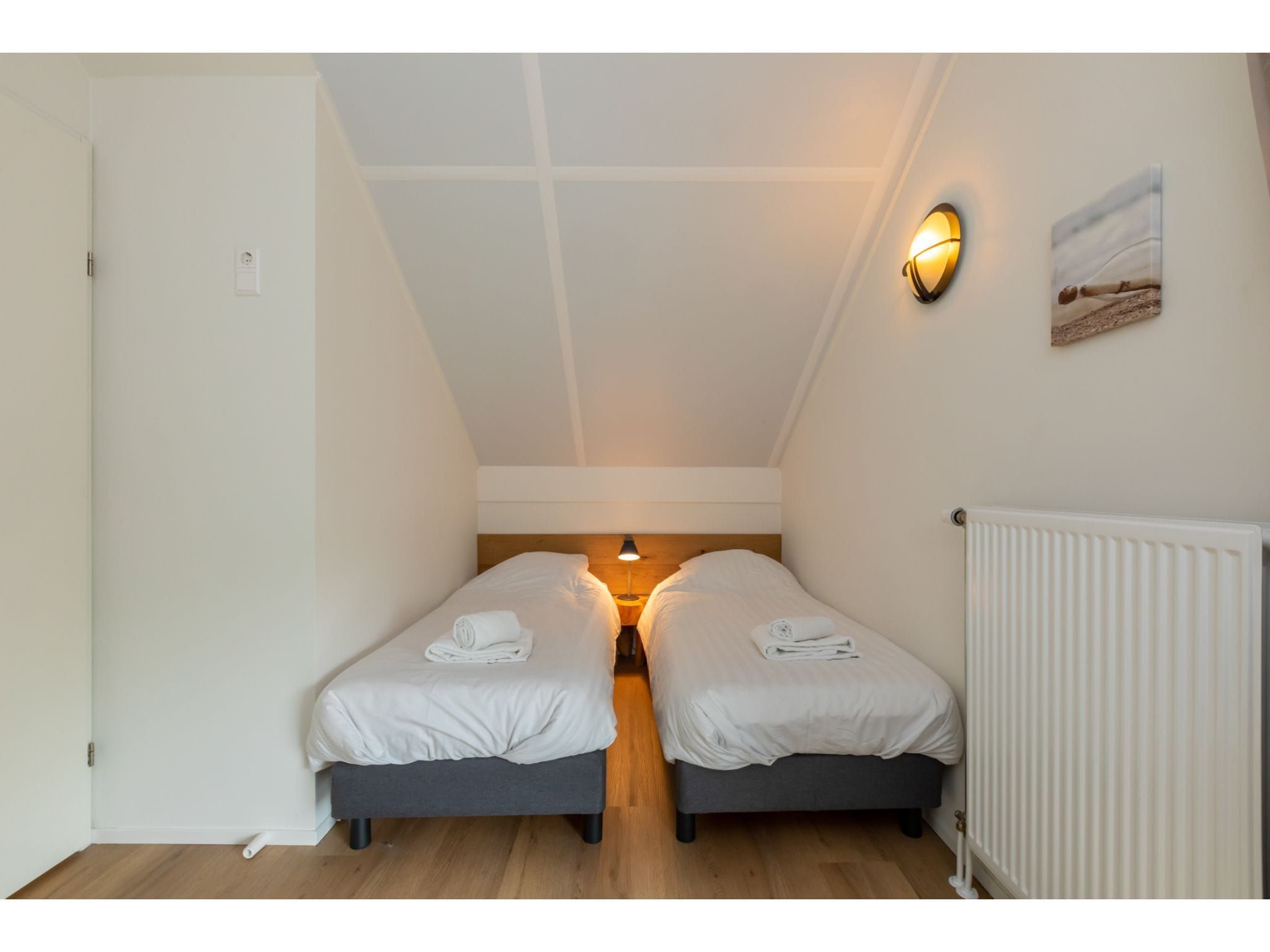 Een slaapkamer van Kloosterweg 85 in Burgh Haamstede