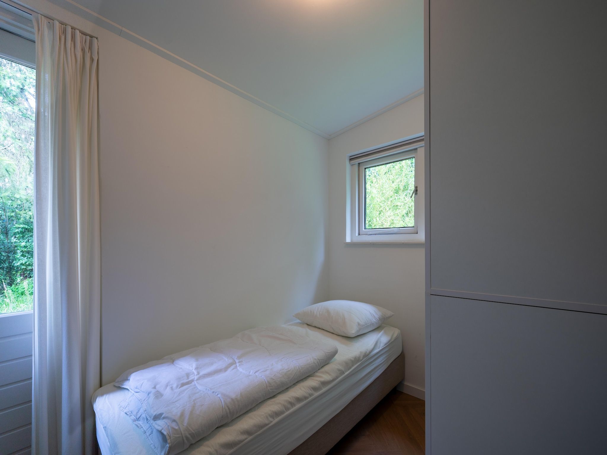 Een slaapkamer van Bos suite in Zelhem