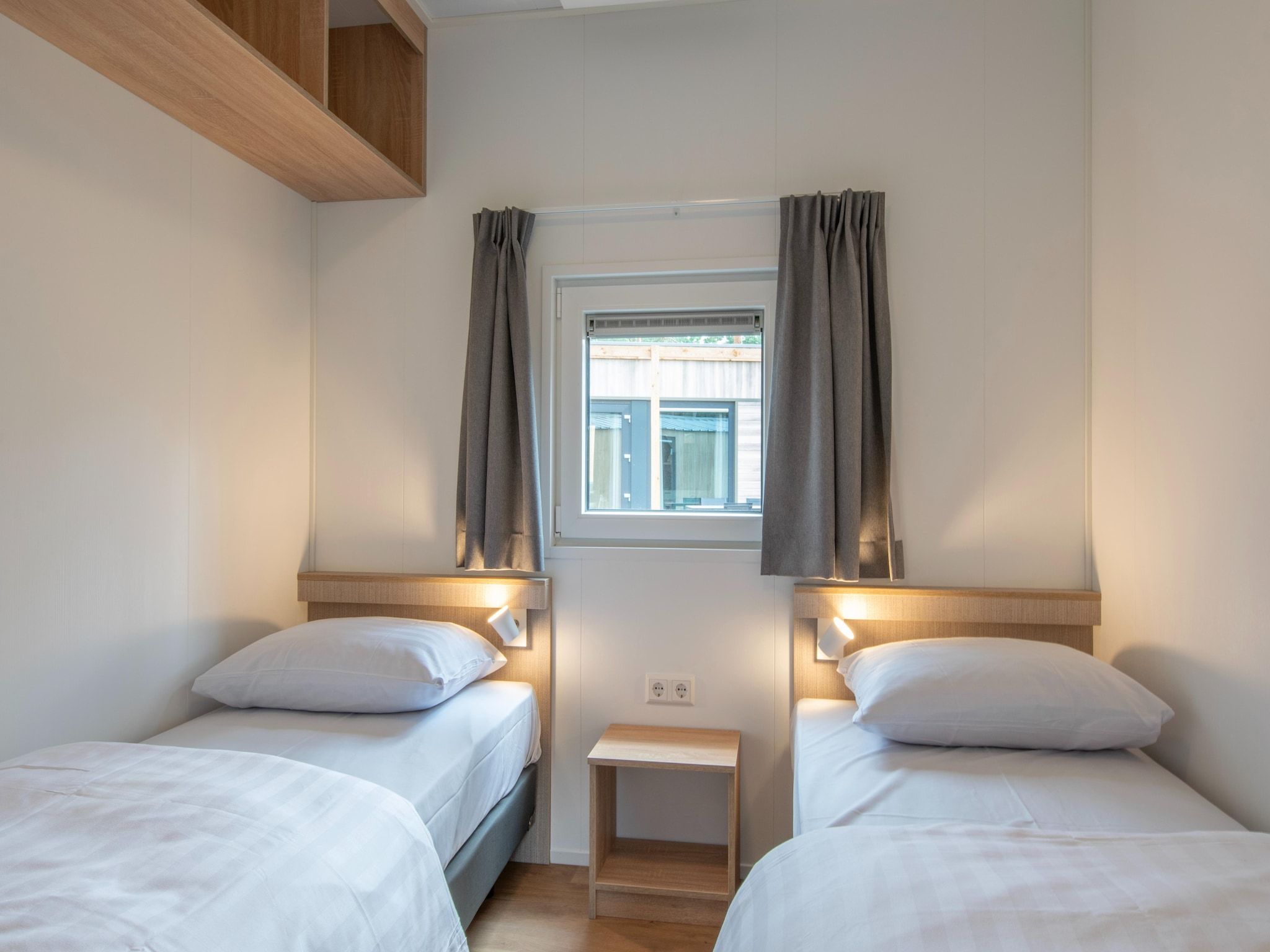 Een slaapkamer van Bospark 't Wolfsven 20 in Mierlo