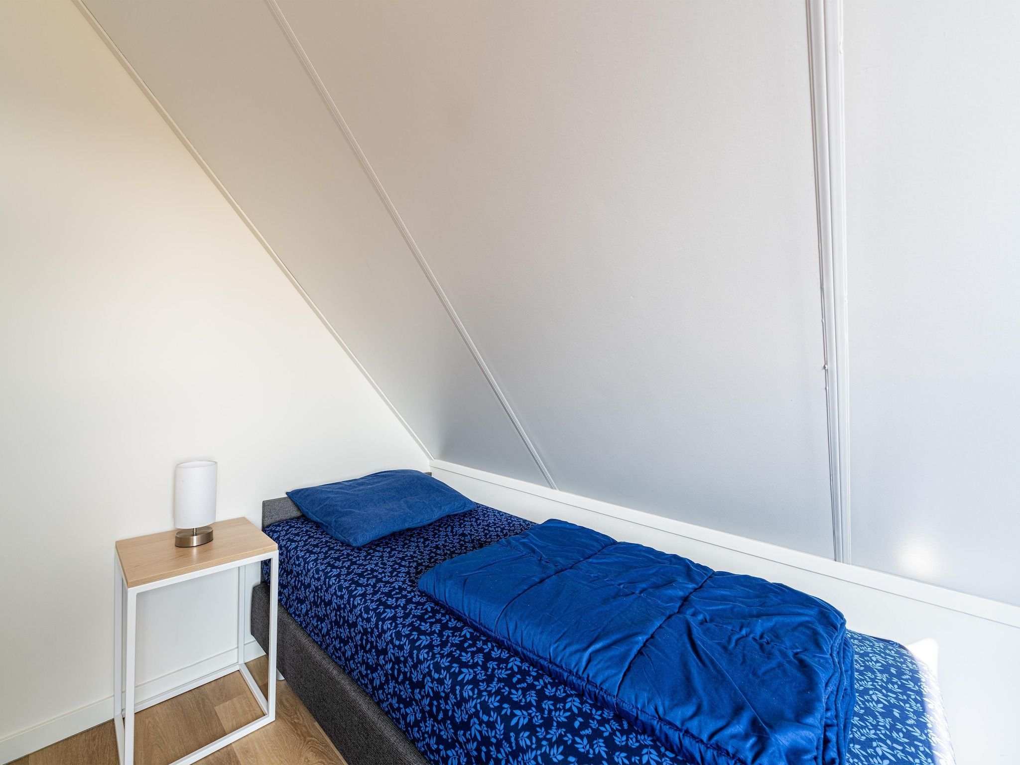 Een slaapkamer van Kuifduiker 138c in Simonshaven