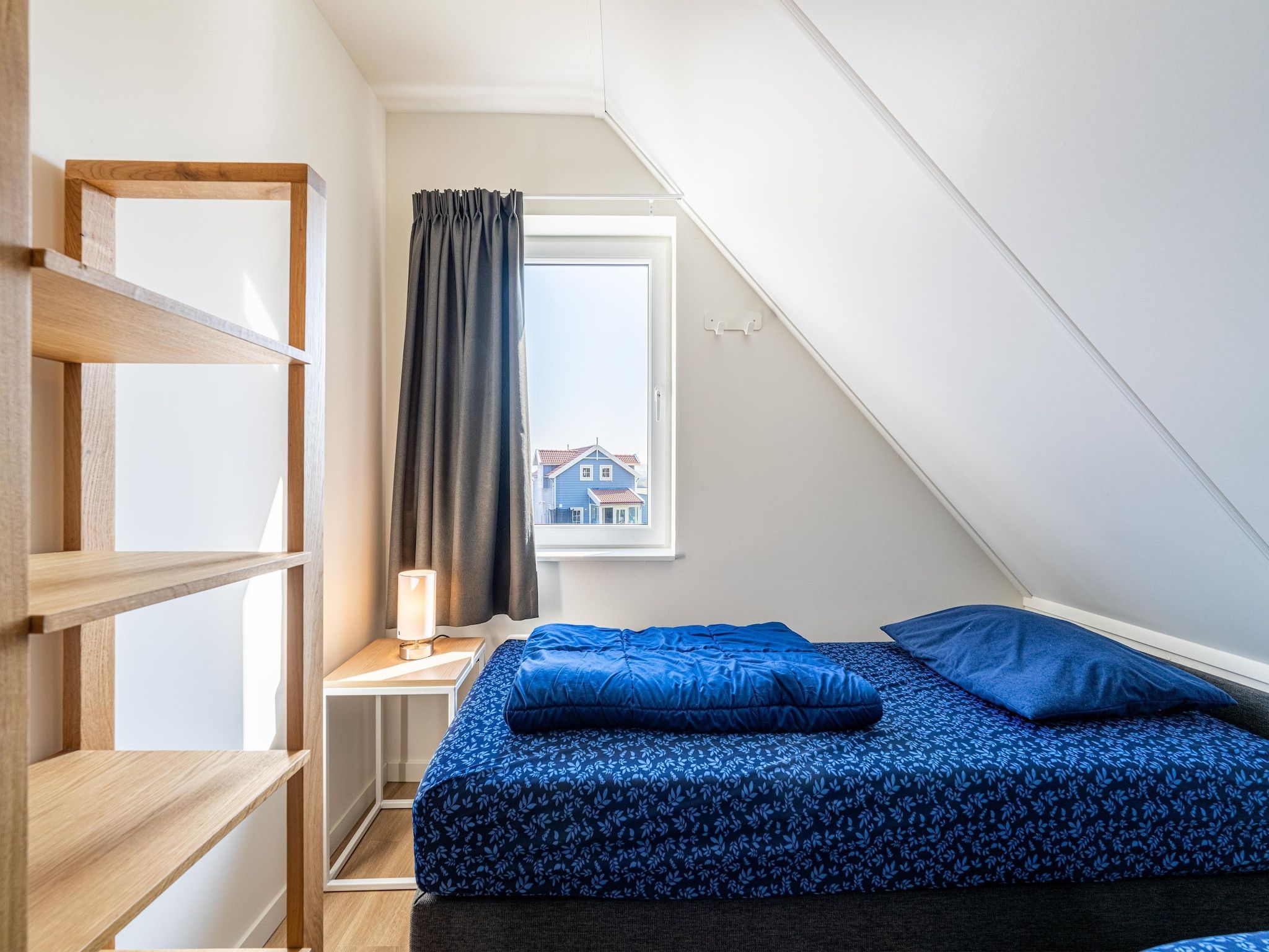 Een slaapkamer van Kuifduiker 138c in Simonshaven