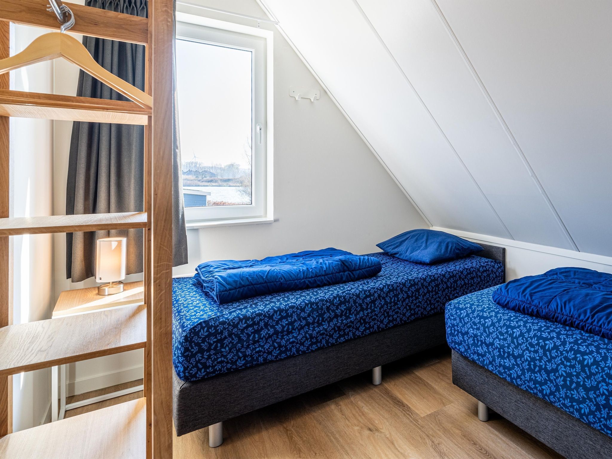 Een slaapkamer van Kuifduiker 138c in Simonshaven