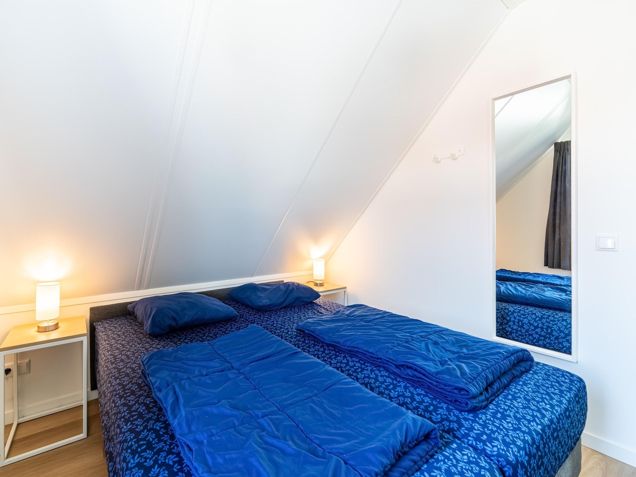 Een slaapkamer van Kuifduiker 138c in Simonshaven